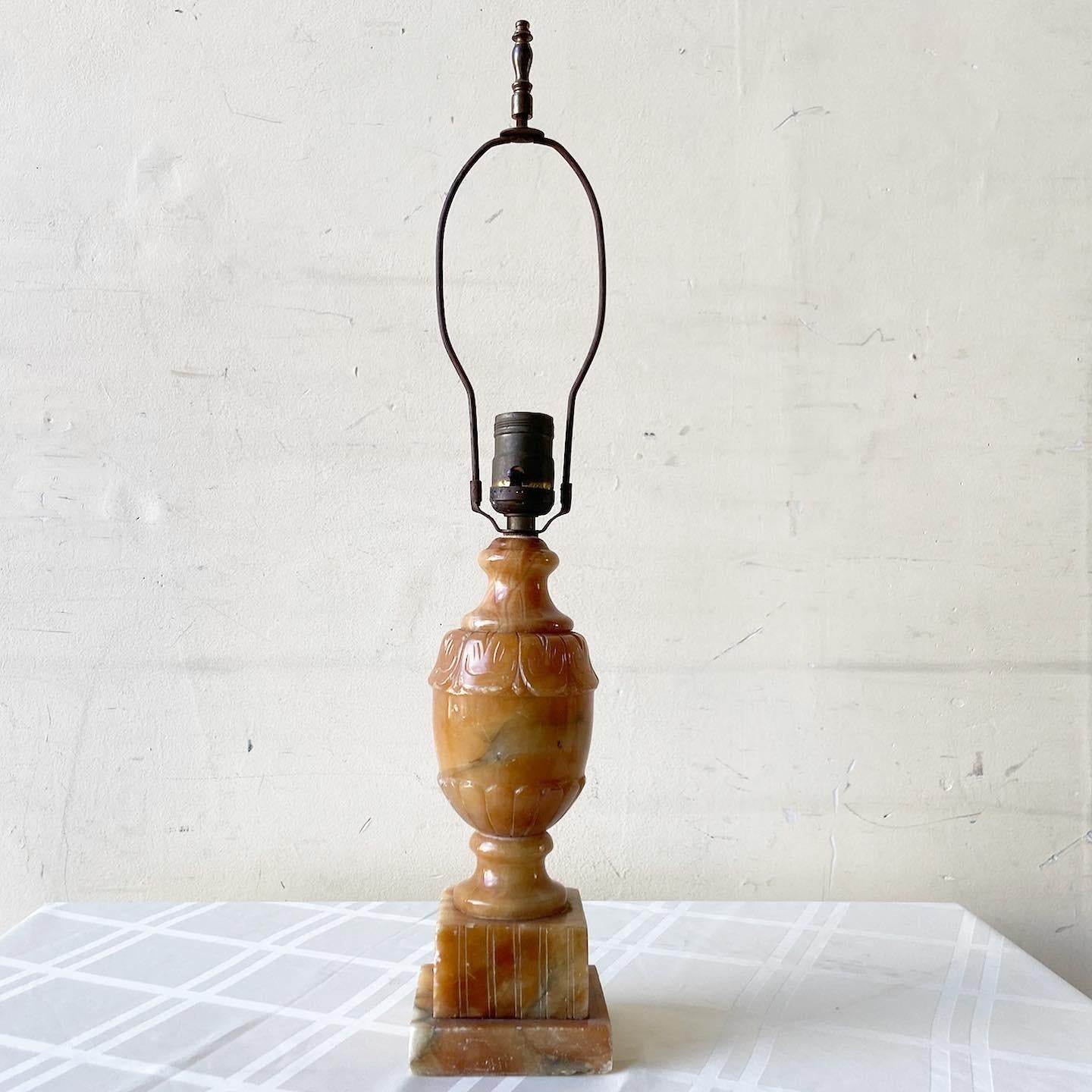 Exceptional early 20th century light brown table lamp. Features a hand carved and polished ornate design.
 