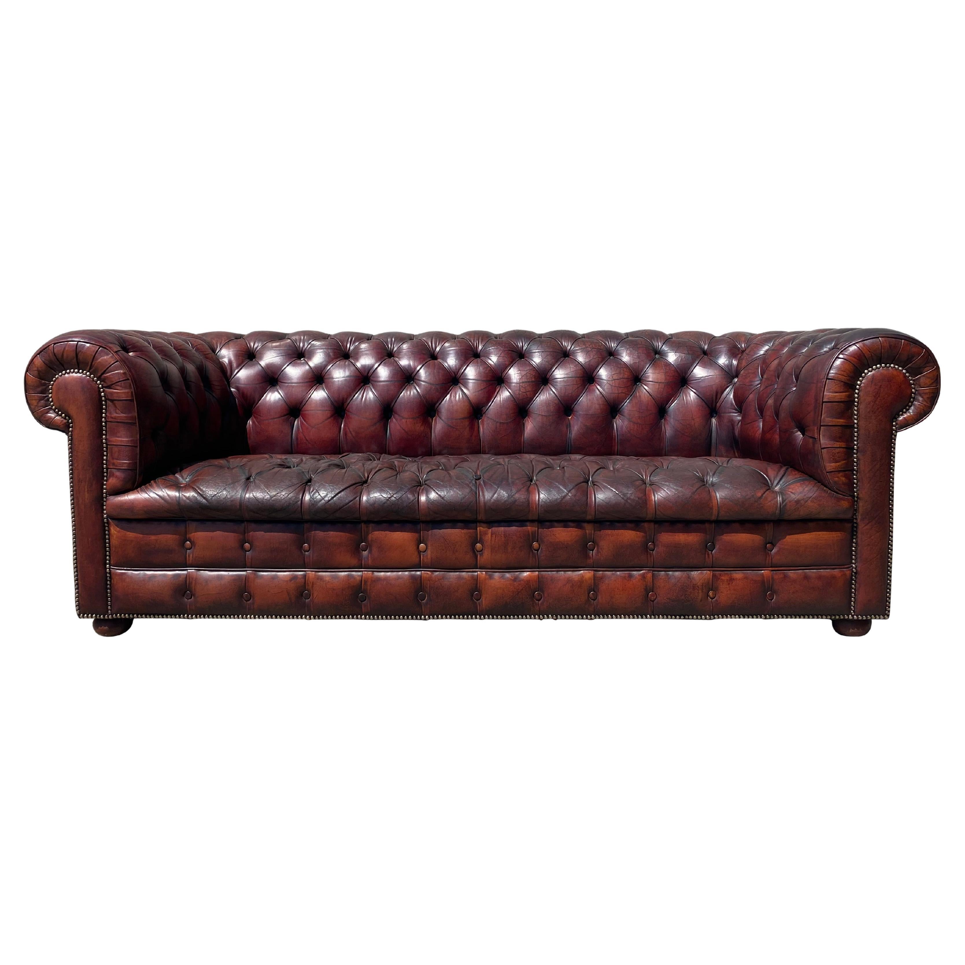 Early 20th Century Burgundy Colour Leather Three Seater Chesterfield For Sale