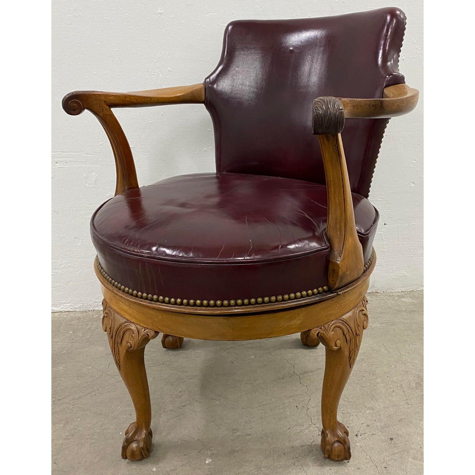 American Early 20th Century Burgundy Leather and Carved Oak Swivel Chair, circa 1920 For Sale