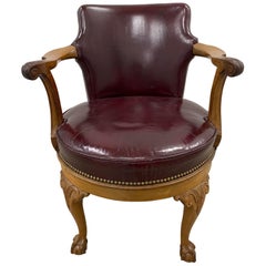 Early 20th Century Burgundy Leather and Carved Oak Swivel Chair, circa 1920