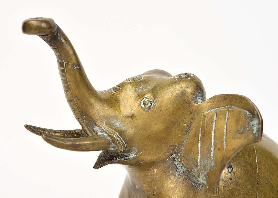 Burmese bronze standing elephant with stand.

Age: Burma, Early 20th Century
Size: Height 16.8 C.M. / Width 10 C.M. / Length 15 C.M.
Size including stand: Height 17.5 C.M.
Condition: Nice condition overall (some expected degradation due to its