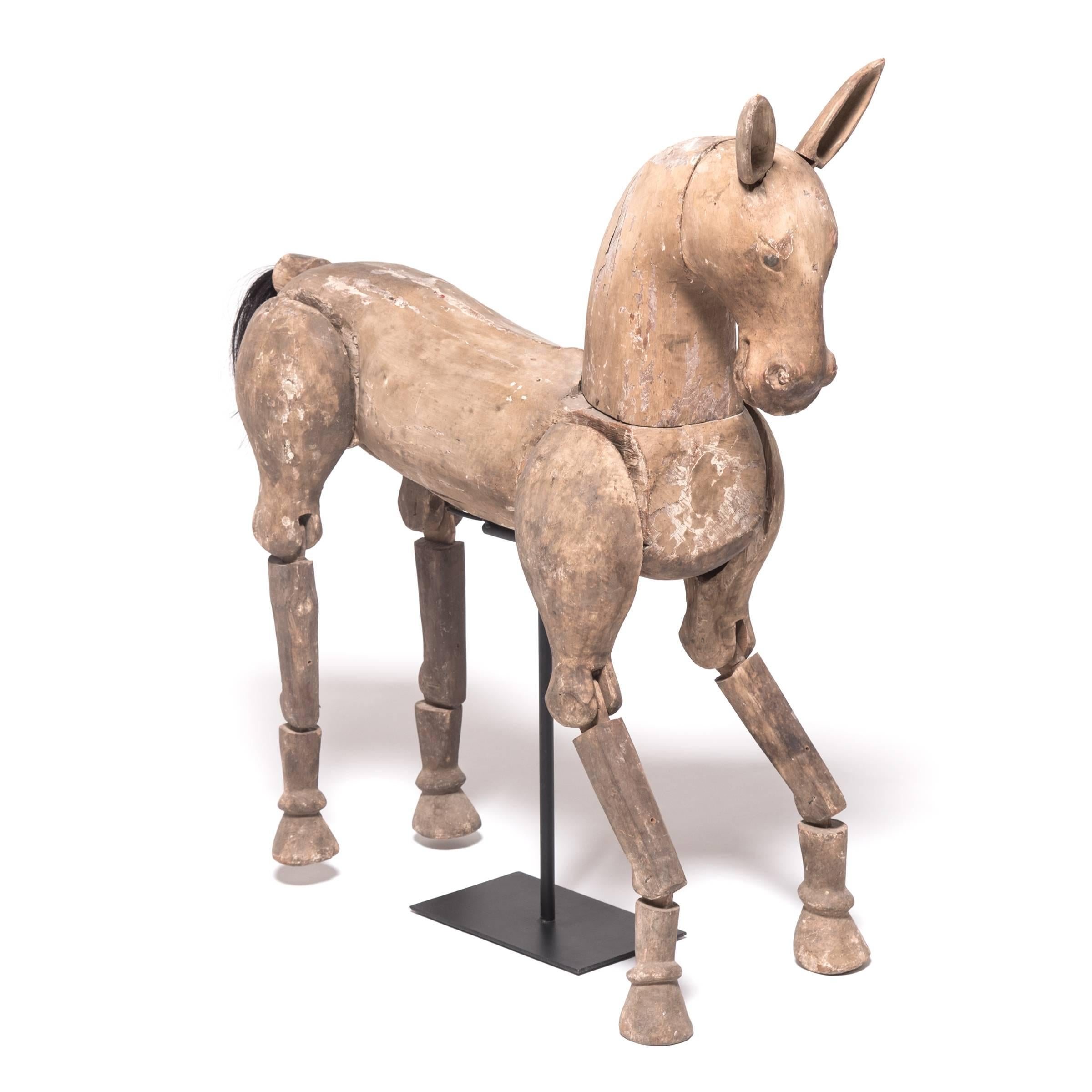 Once colorfully painted and tacked with brilliant saddlery, this wooden horse puppet likely starred in a puppet show as the mount of character from a Buddhist folktale or legend. Puppet plays were performed in Burma as early as the 1400s and reached