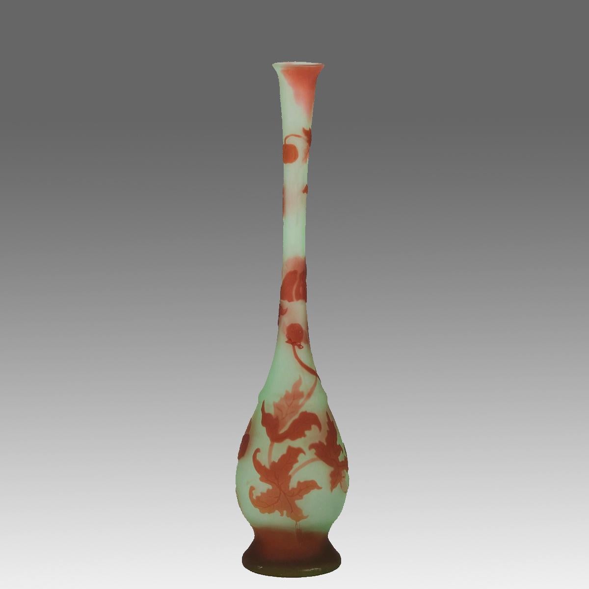 An unusual late French Art Nouveau tall slender cameo glass vase decorated with raised deep orange falling leaves against a mint green field. Exhibiting excellent detail and colour, signed Galle in cameo.

ADDITIONAL INFORMATION
Height:             