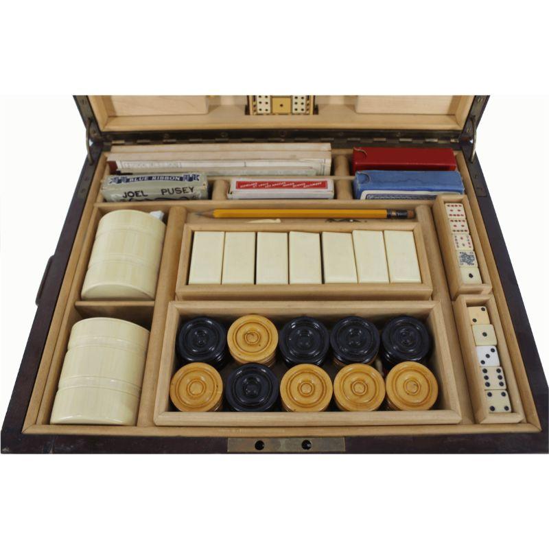 Includes: chess, checkers, dice, dominoes, chips, etc. Dimensions: 10.5 H x 14.5 W x 11.5 D.