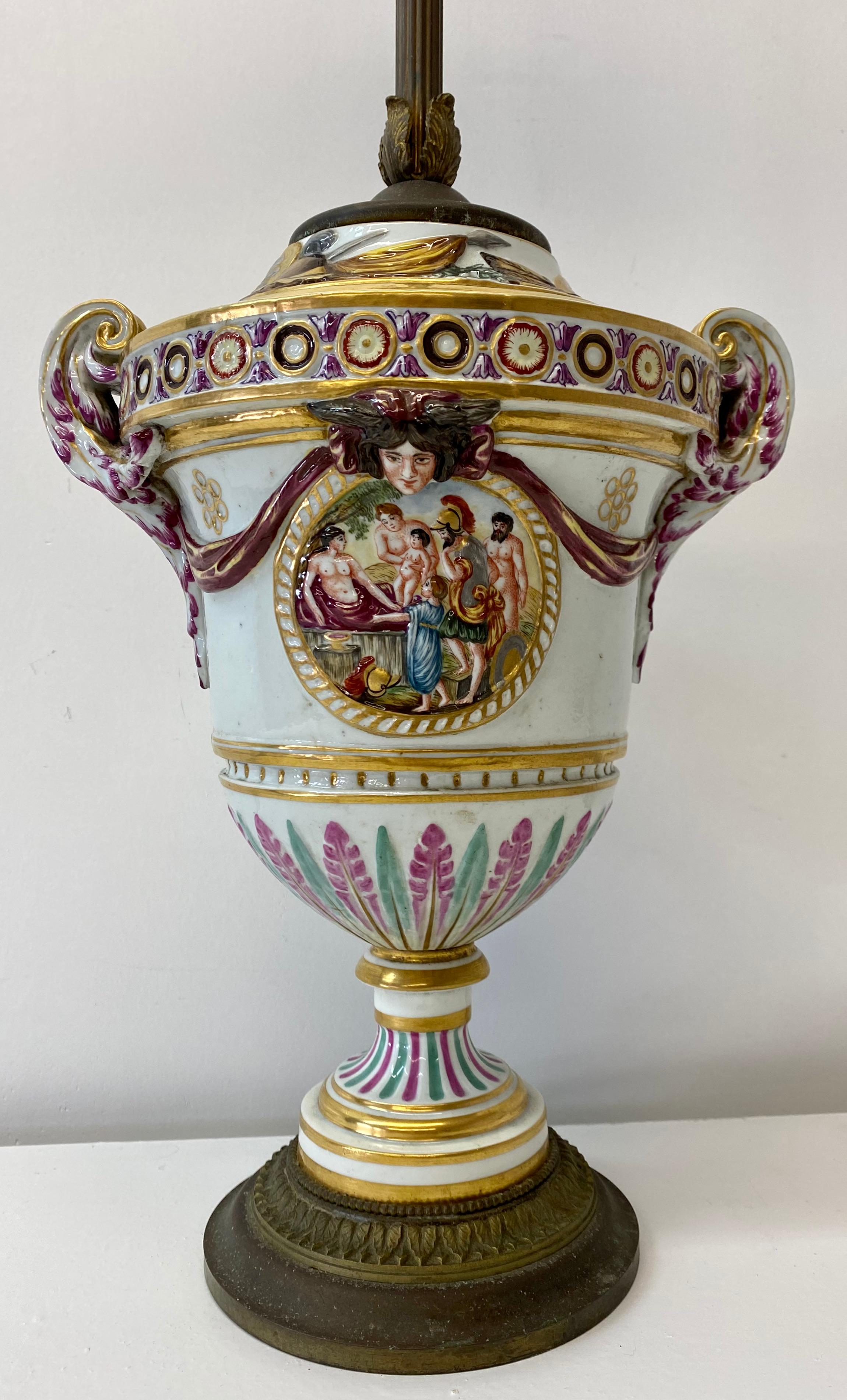 Early 20th century capodimonte porcelain double socket table lamp

Beautiful hand painted mythological Roman scenes featuring Romulus and Remus

5.75
