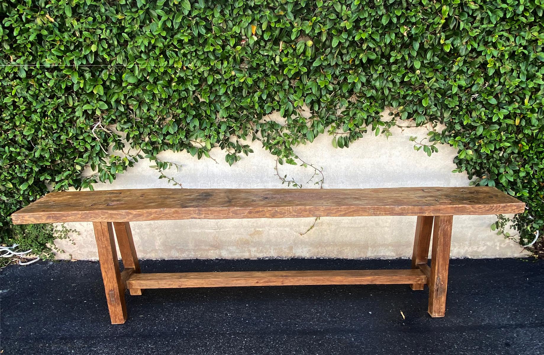Handsome early 20th c Guatemalan Cypress wood carpenter's bench with signs of use and wear, giving it a nice patina. Looks like it was also used as an altar table considering the old burn marks, which is typical of old Guatemalan pieces.
This piece