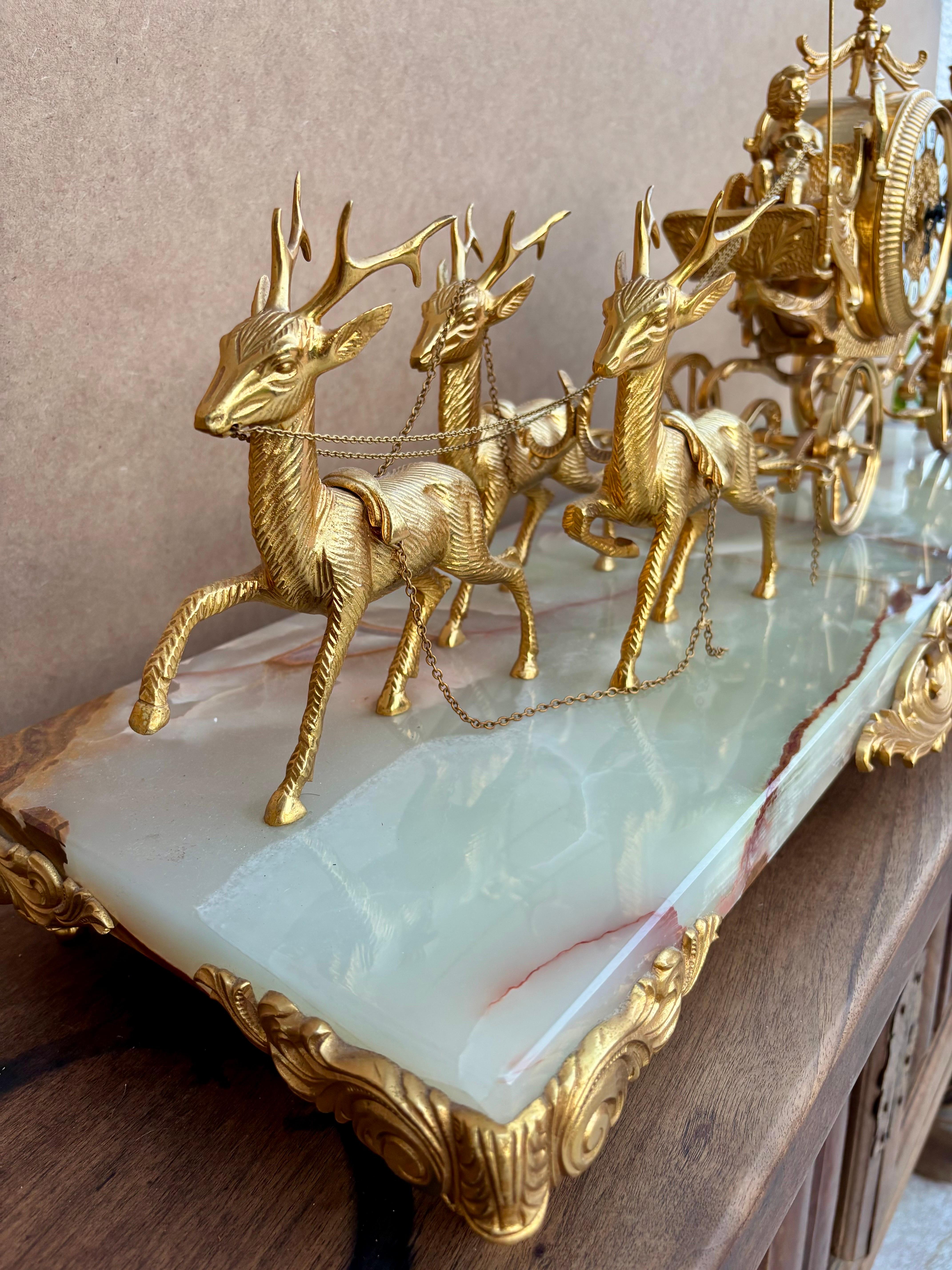 An elegant carriage clock set with complementary candlesticks, known as a 