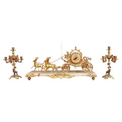 Early 20th Century Carriage Clock With Deer And Candlesticks In Gilt Bronze