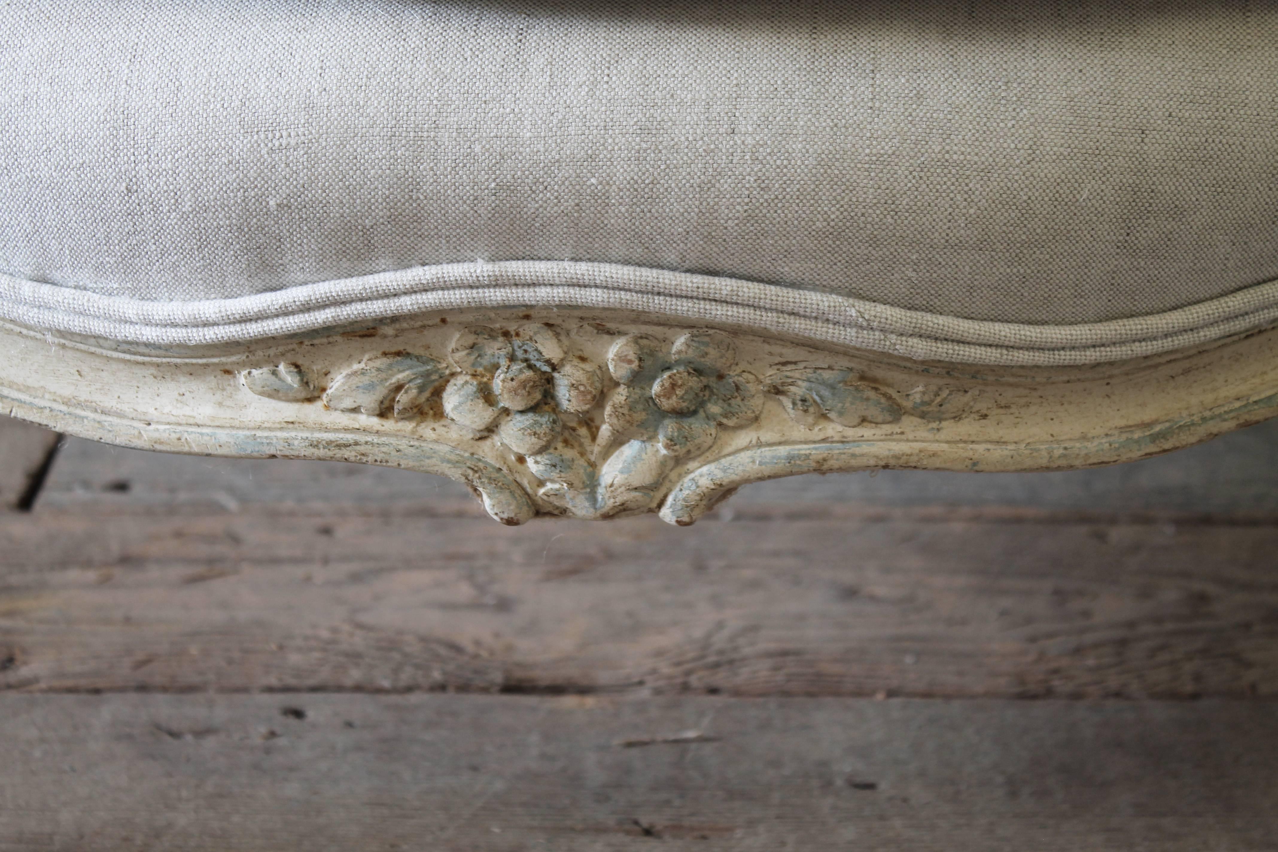 Fruitwood Early 20th Century Carved and Painted Bergere Chair Upholstered in Natural Linen
