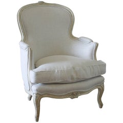 Antique Early 20th Century Carved and Painted Bergere Chair Upholstered in Natural Linen