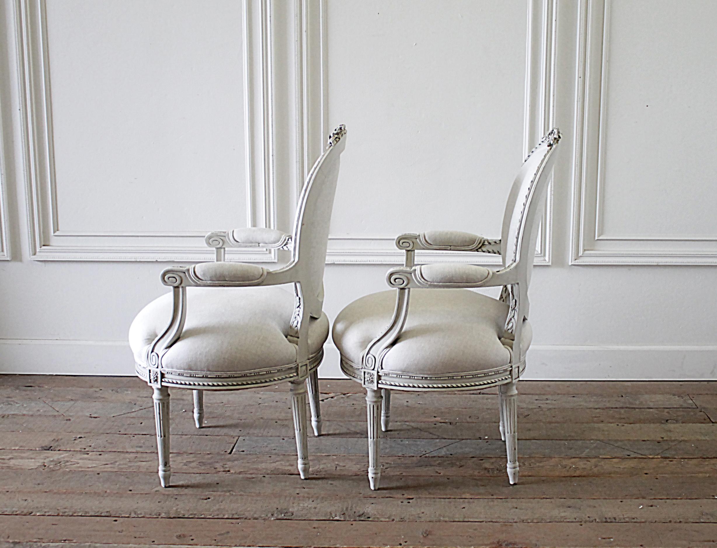 European Early 20th Century Carved and Painted Louis XVI Style French Open Arm Chairs