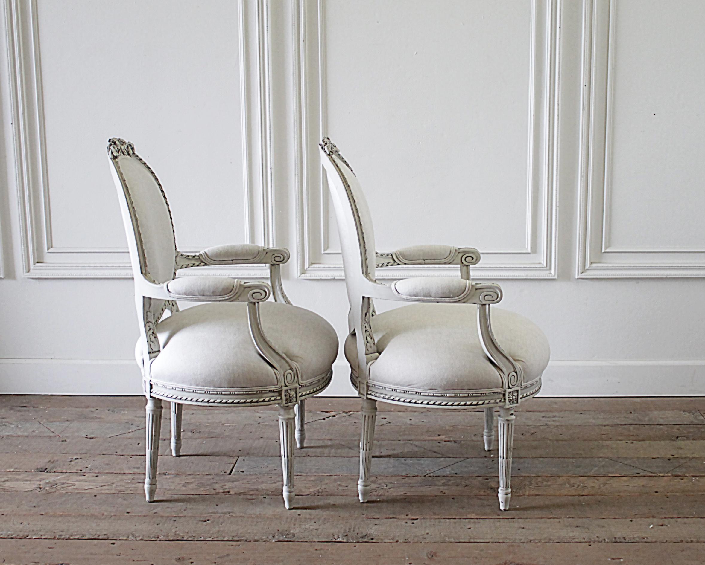 Linen Early 20th Century Carved and Painted Louis XVI Style French Open Arm Chairs
