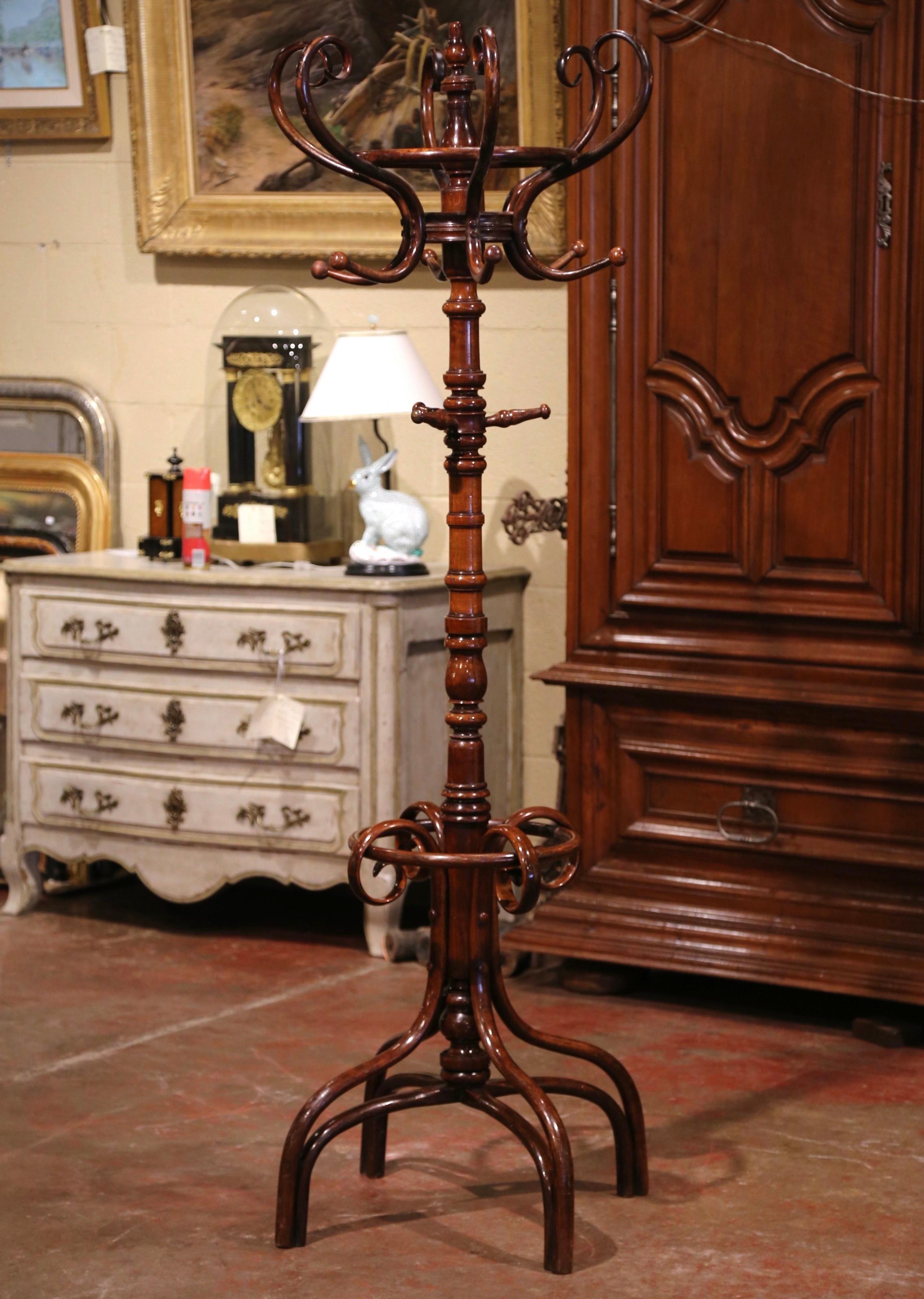 Bring a retro, yet practical touch to any entry or dressing area with this elegant, carved coat stand. The useful hat rack was crafted in France, circa 1900 in the style of German-Austrian cabinet maker, Michael Thonet (1796-1871). The hall tree