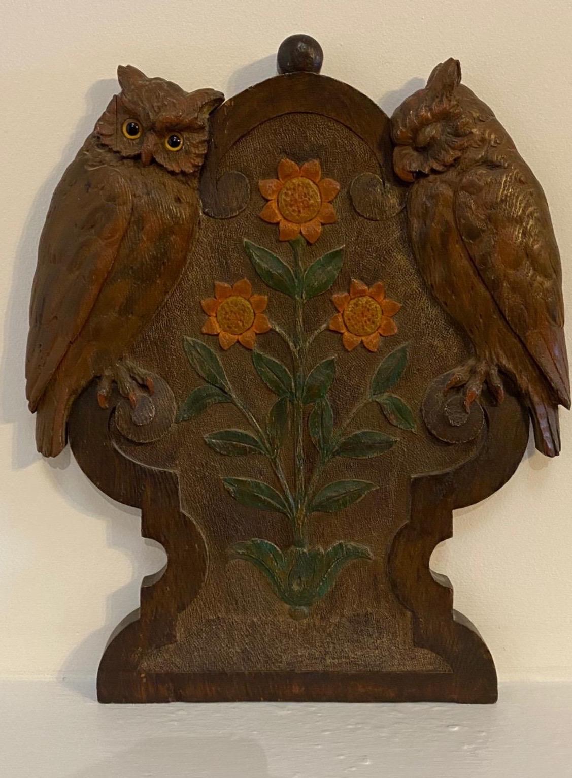 Early 20th century carved Folk Art plaque of owls and sunflowers. Glass eyes.