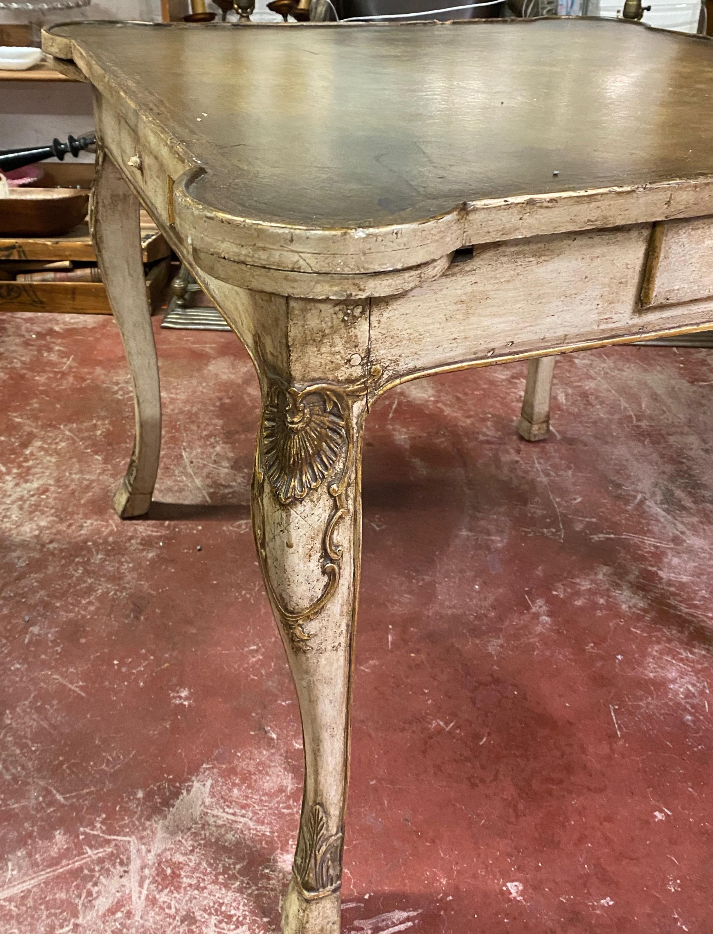 Early 20th century carved French games table with leather top, circa 1920

Beautiful games table with a leather top, four corner folding cup holders and a single drawer on each side.

Dimensions 32