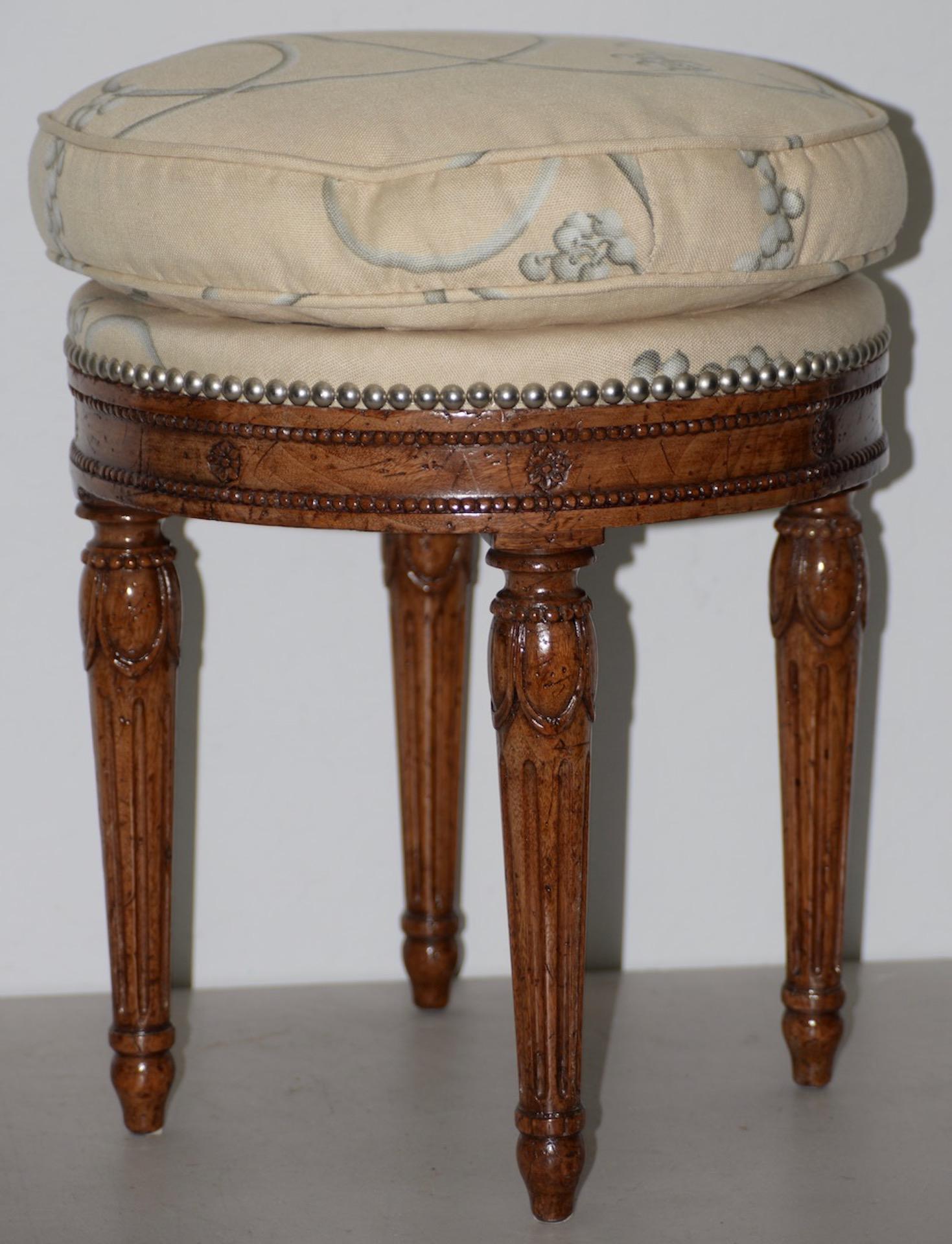 Early 20th century carved French walnut round seat

Beautifully carved glazed walnut seat with four legs. The cotton upholstery is filled with down.

Solid, sturdy and comfortable.

Dimensions: 16