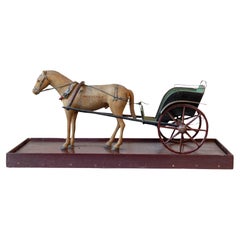 Modello di cavallo e carrozza in legno intagliato dei primi anni del XX secolo
