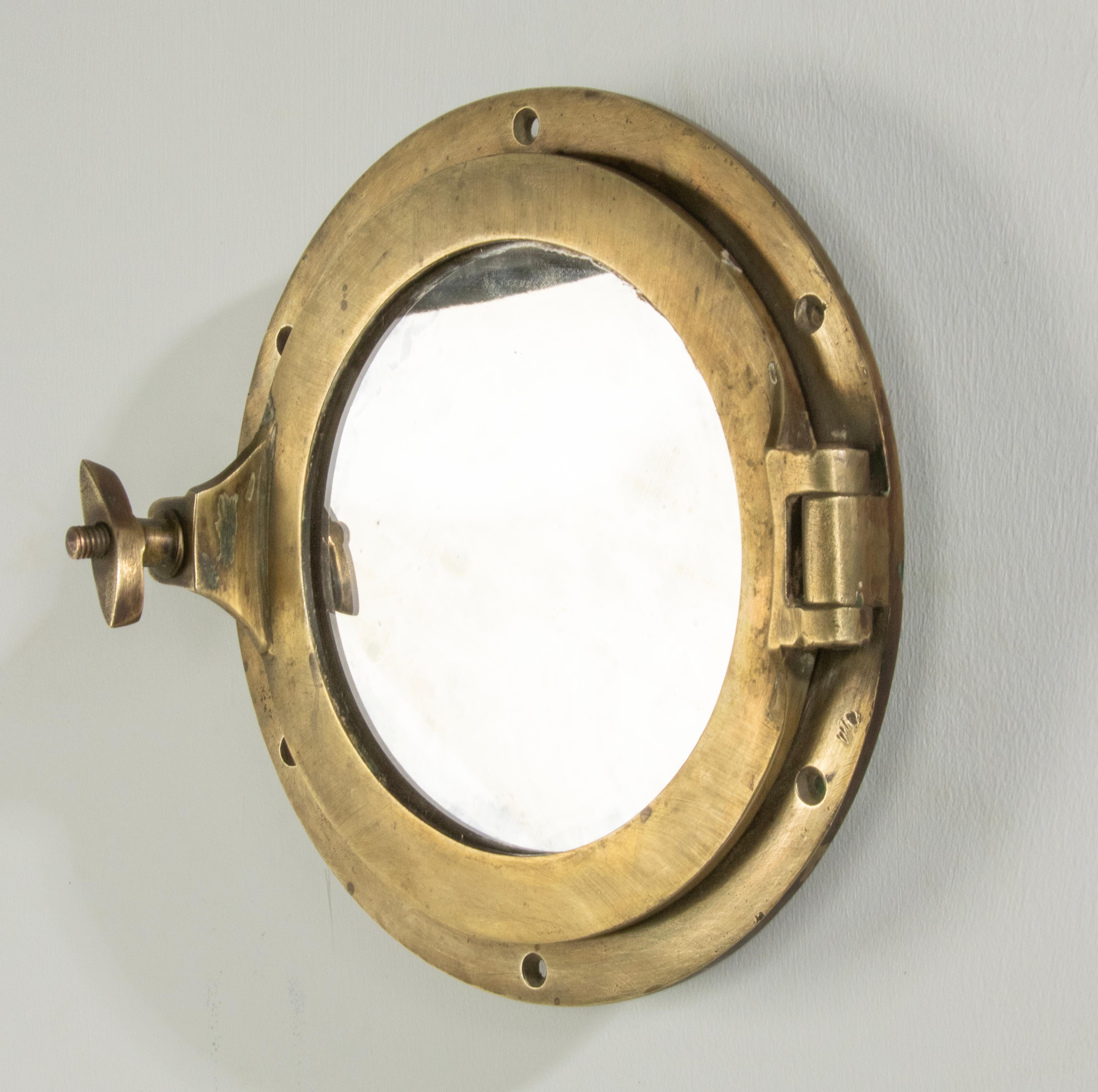 Early 20th Century Cast Brass Small Mirror Ship Porthole In Fair Condition For Sale In Casteren, Noord-Brabant