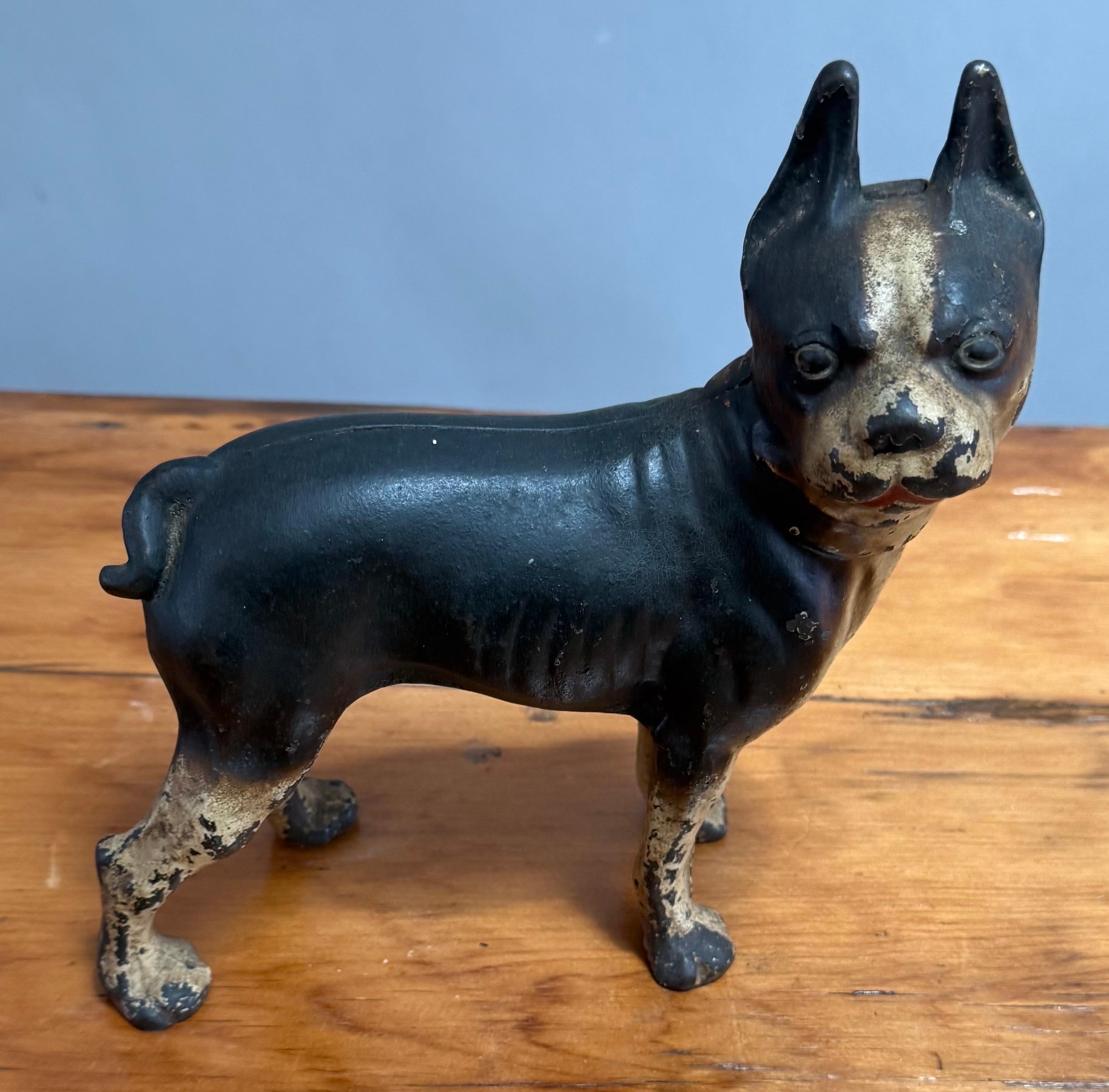 Early 20th Century Cast Iron Boston Terrier Doorstop. 

An iconic example of early 20th-century American cast iron craftsmanship, this Boston Terrier doorstop captures the alert posture and stout physique of the beloved breed. Made circa 1920, the