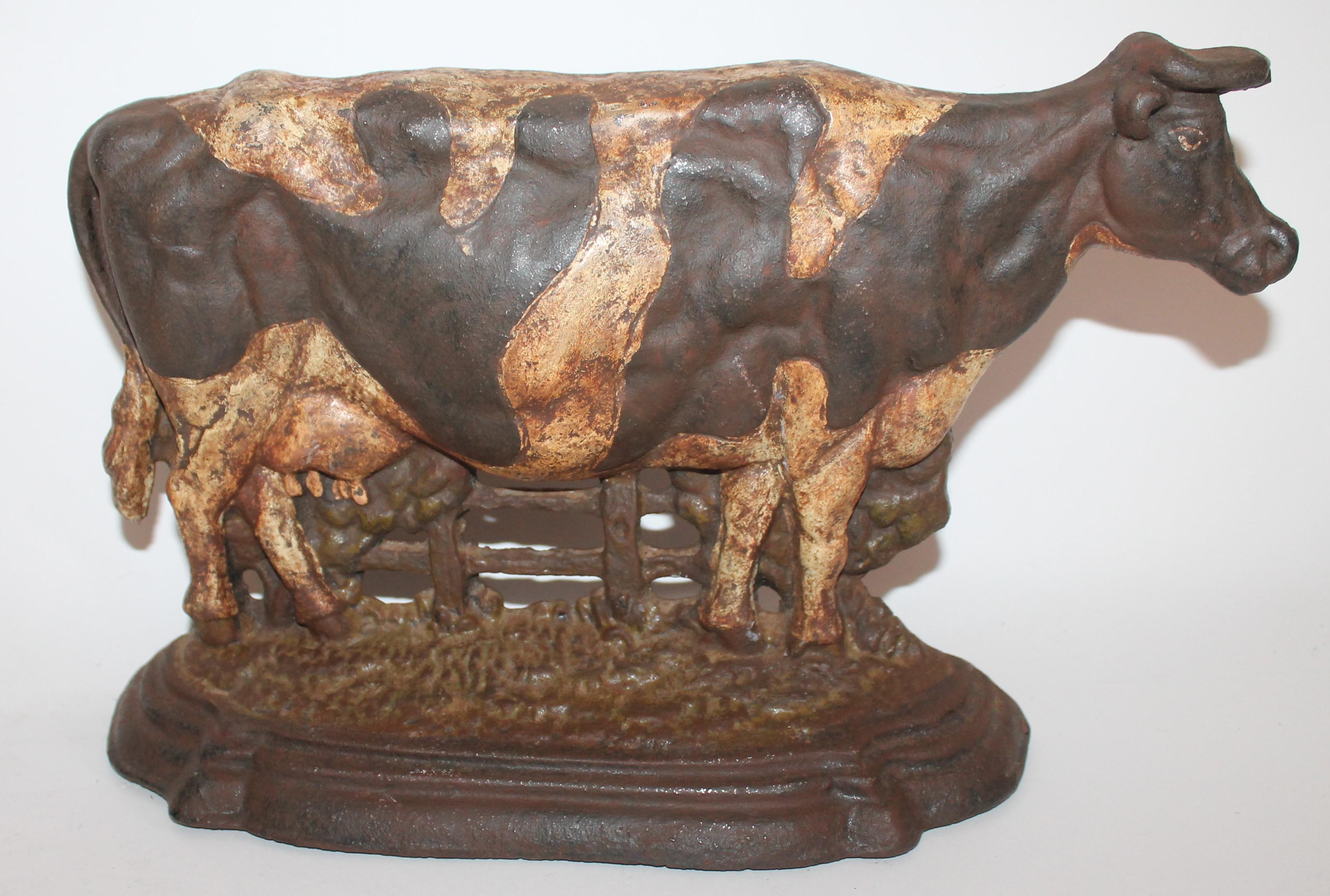 This original painted cast iron cow door stop is in in good condition. It is unsigned but looks like a Hubley.