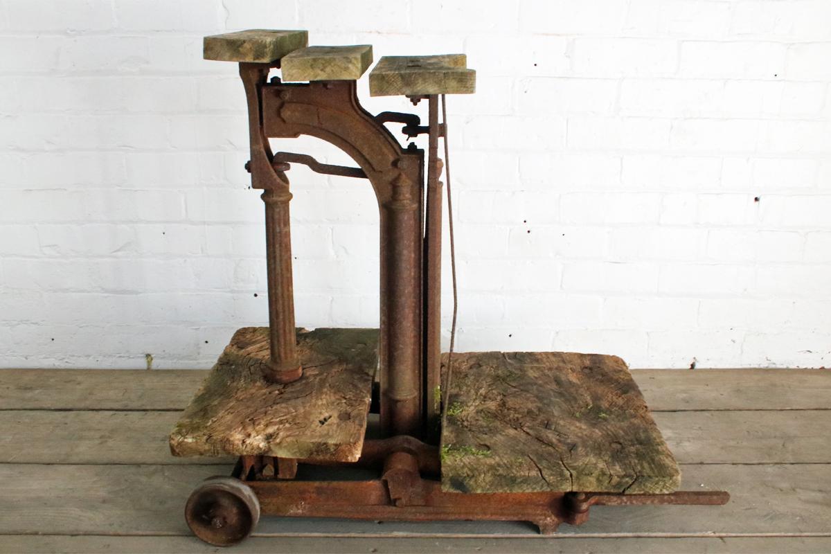 An early 20th century cast iron sack weighing scales produced by W&T Avery Ltd. First patented in 1879. 
In untouched condition with excellent patina and grain pattern to the wooden weighing plates. Both wheels fully working. One of the two swing