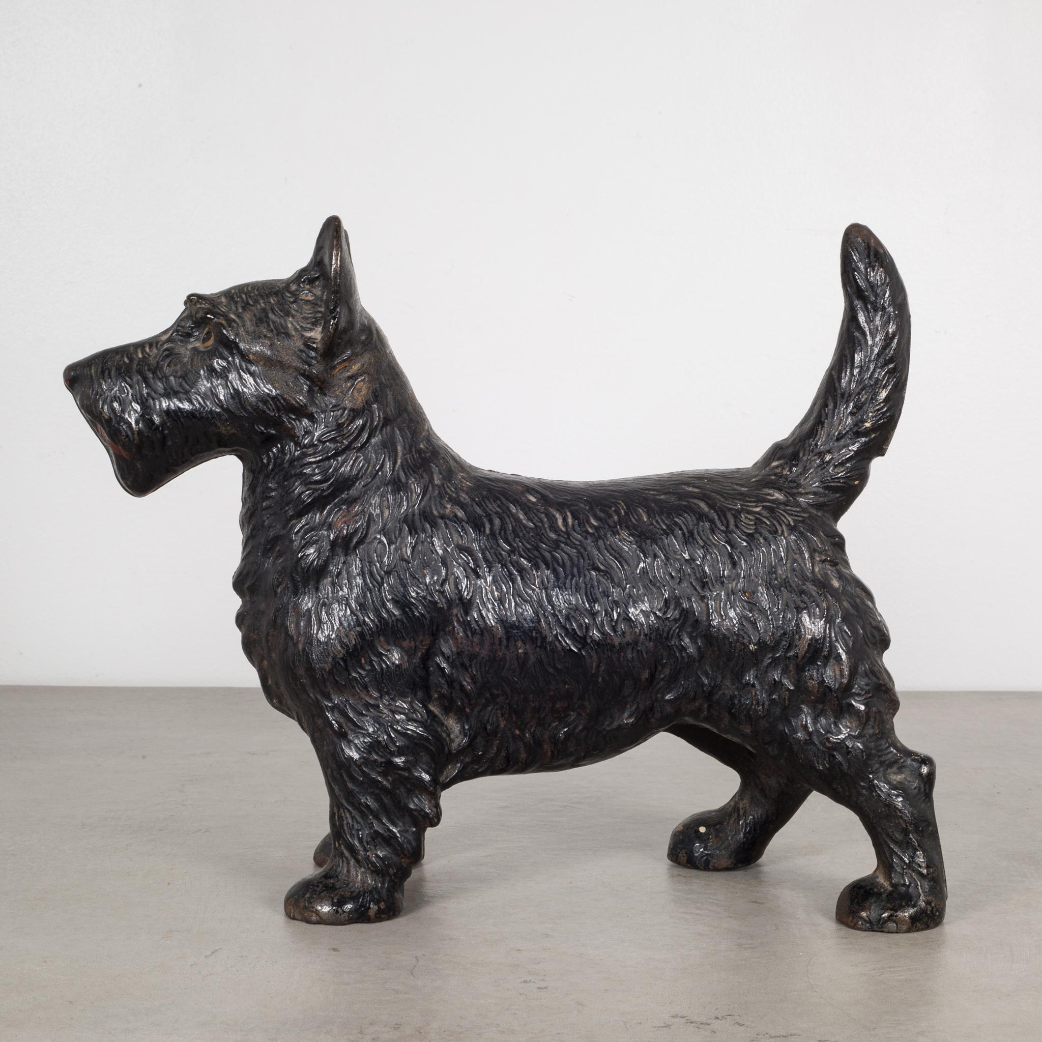 This is an original cast iron Scottish Terrier doorstop manufactured by the Hubley Manufacturing Company in Lancaster Pennsylvania USA. The piece has retained its original hand painted finish and is in excellent condition with the appropriate patina