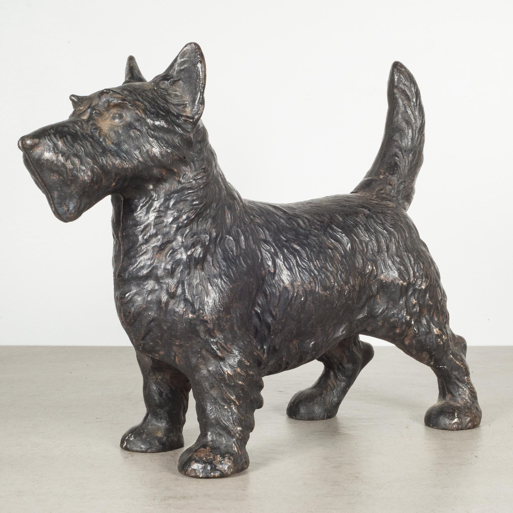 This is an original cast iron Scottish Terrier doorstop manufactured by the Hubley Manufacturing Company in Lancaster Pennsylvania USA. The piece has retained its original hand painted finish and is in excellent condition with the appropriate patina