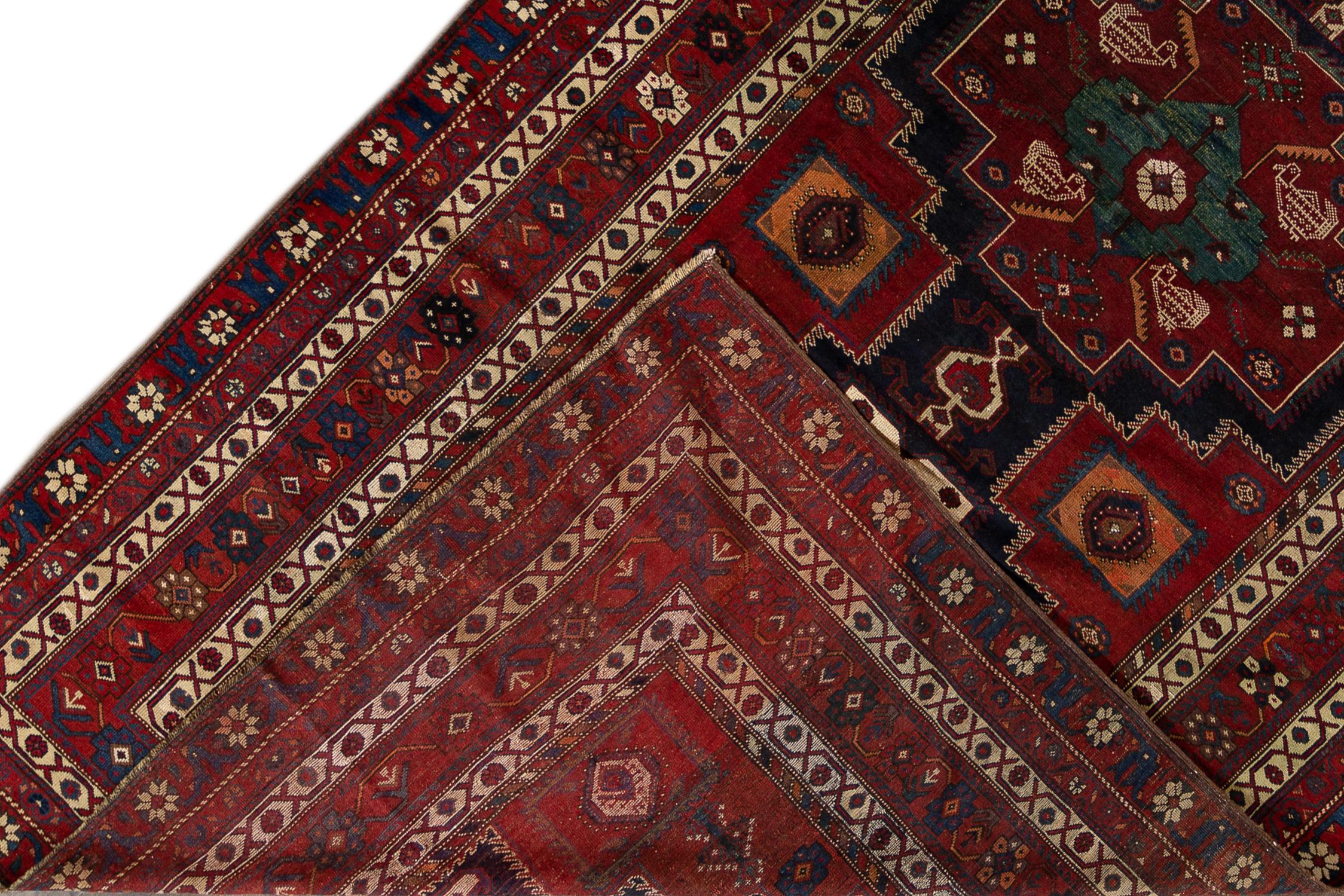 Early 20th century Caucasian blue rug. Measures: 6'9