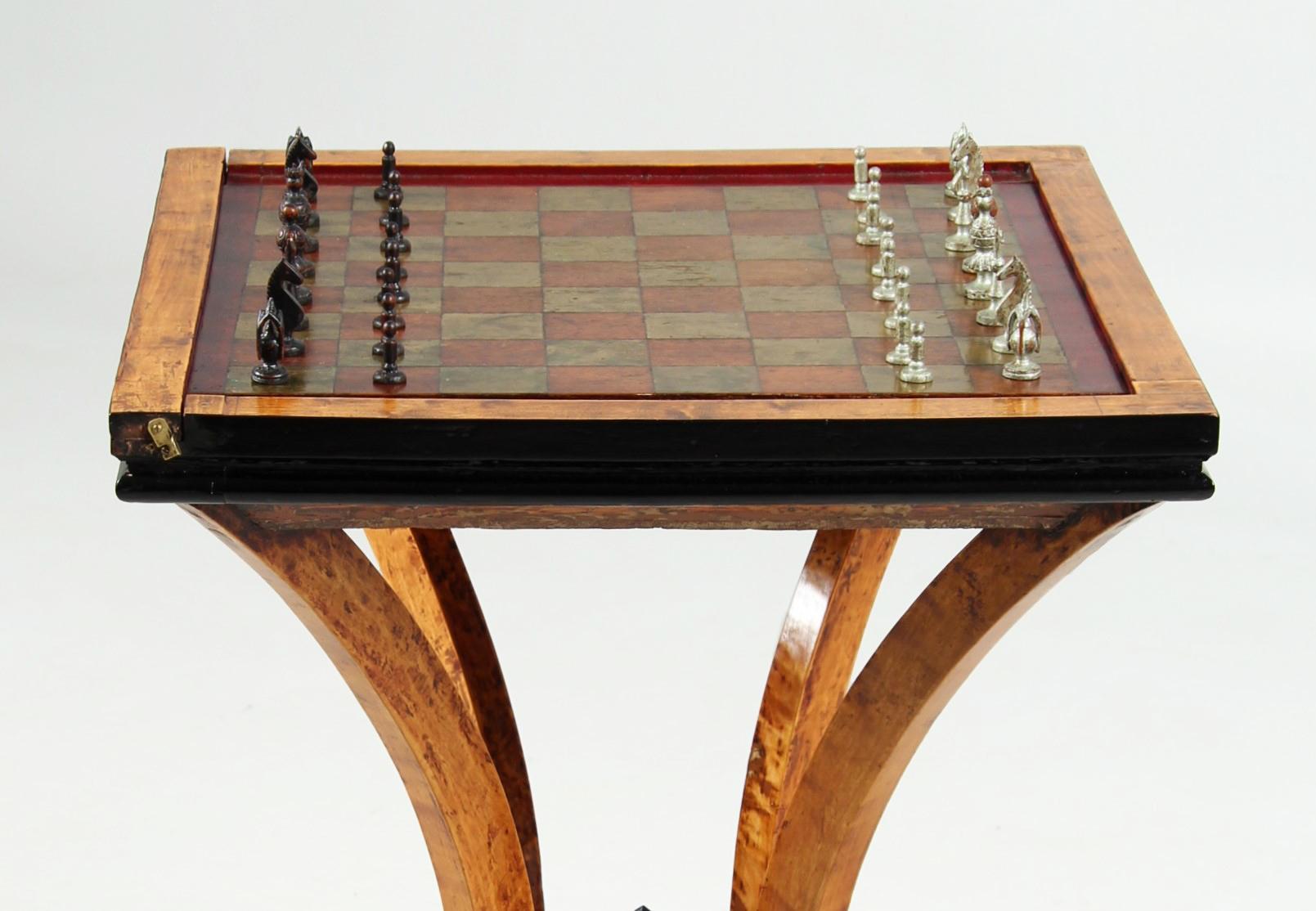Art Deco Chess Table With Turnable Field

Scandinavia
Birch
Art Deco around 1925

Dimensions: H x W x D: 68 x 48 x 48 cm

Description:
Play table made of solid birch, standing on a four-legged, double-arched substructure.

The blackened edge of the