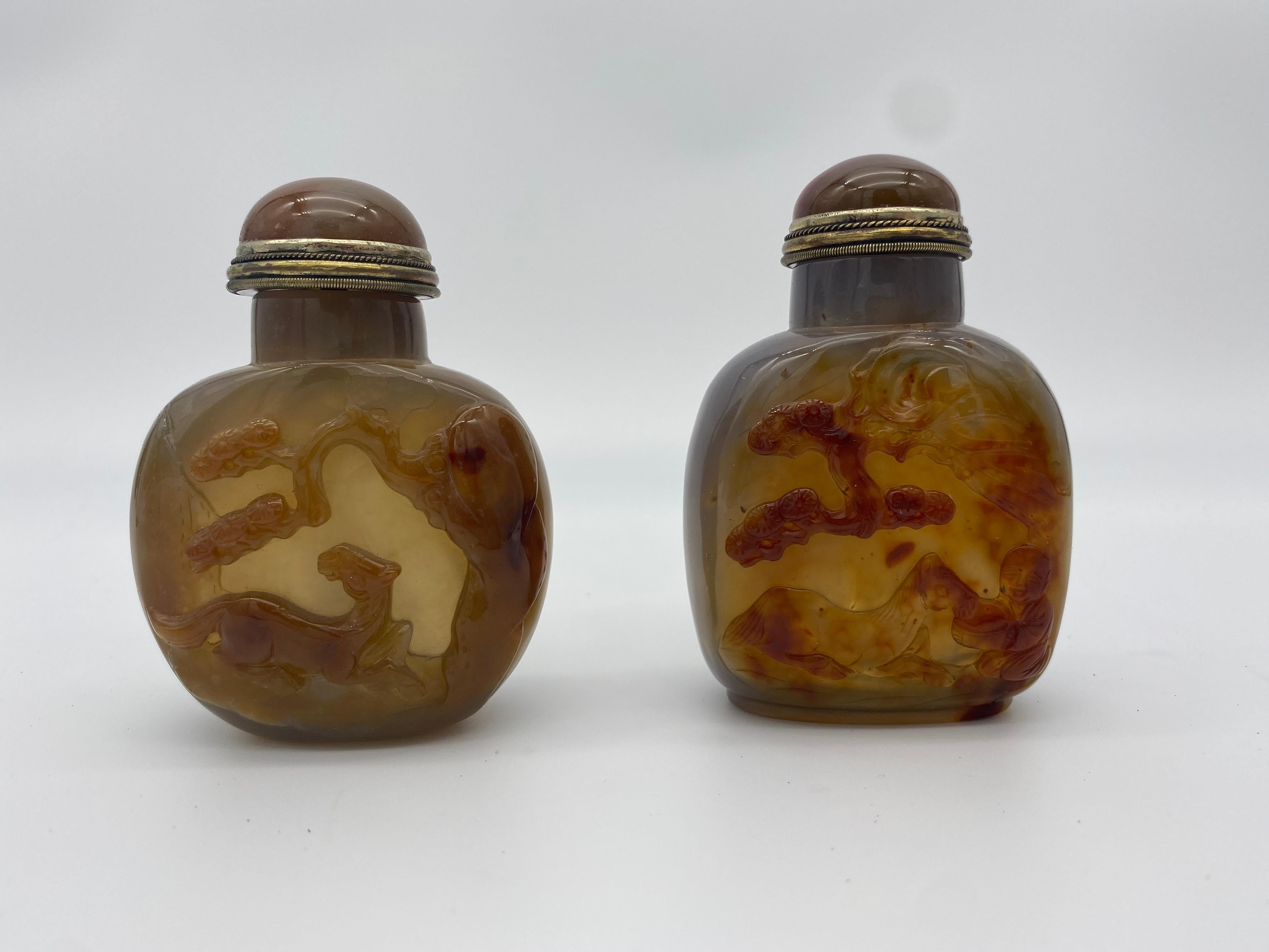Early 20th century Chinese agate and jade snuff bottles from the Qing dynasty. 4 in total. Includes 2 exquisitely carved agate bottles (both 3 1/2