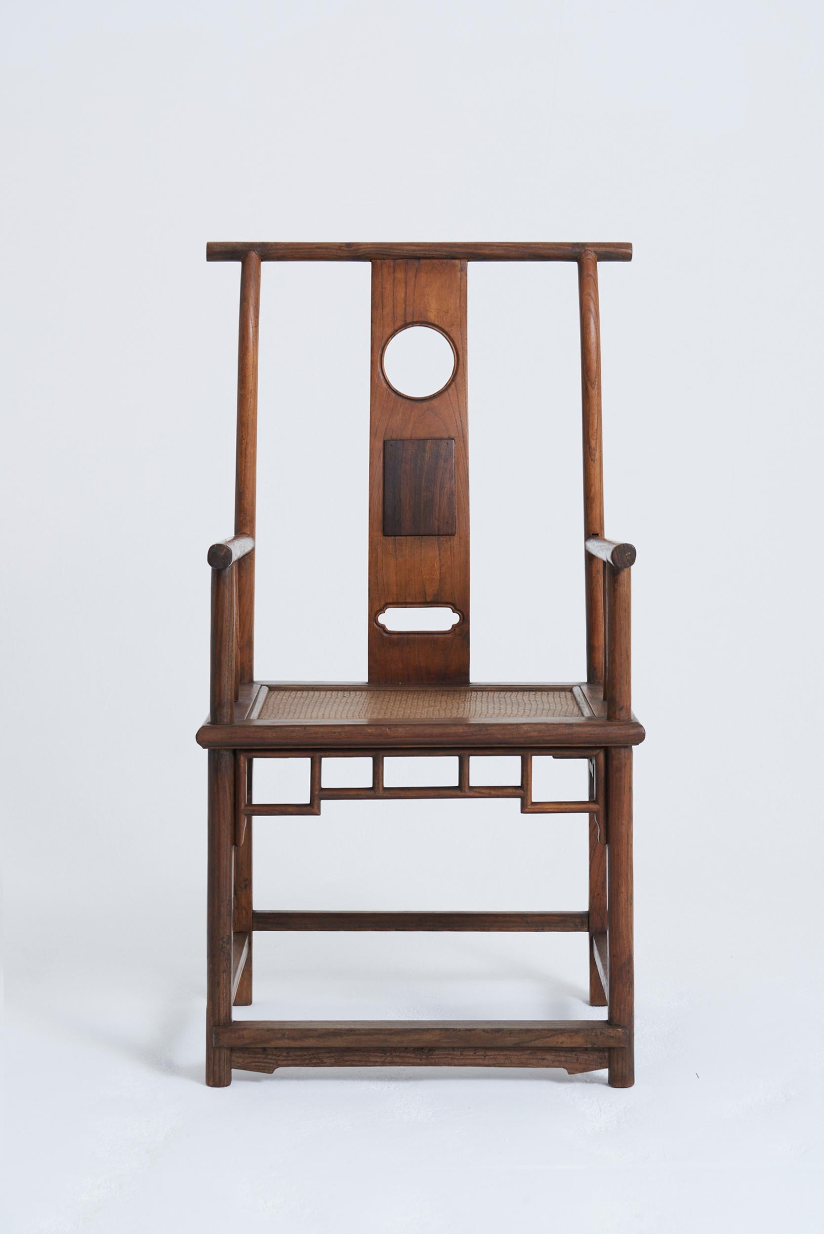 An elm and huanghuali yoke back armchair
China, late 19th Century - early 20th Century
