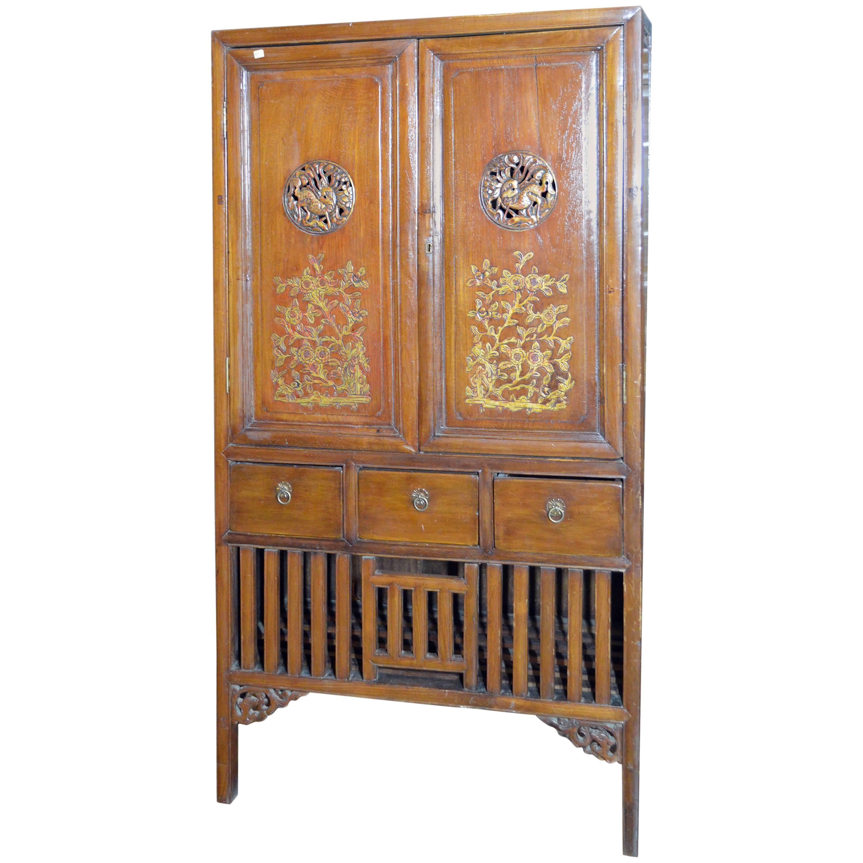 Early 20th Century Chinese Armoire with Gilt Motifs and Hand-Carved Medallions