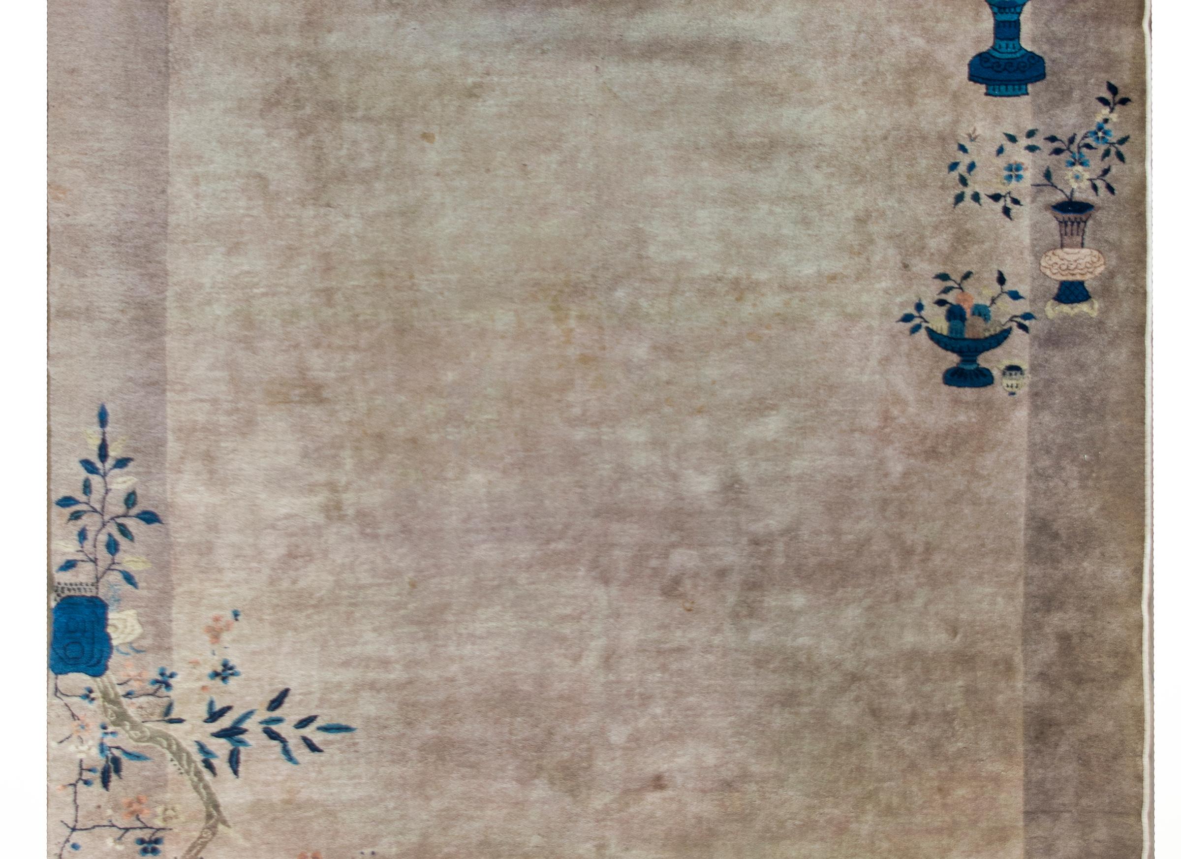 An early 20th century Chinese Art Deco rug with a tone-on-tone gray field surrounded by a wide gray border, and indigo scholar's vases in opposing corners each potted with auspicious flowers including cherry blossoms and peonies.