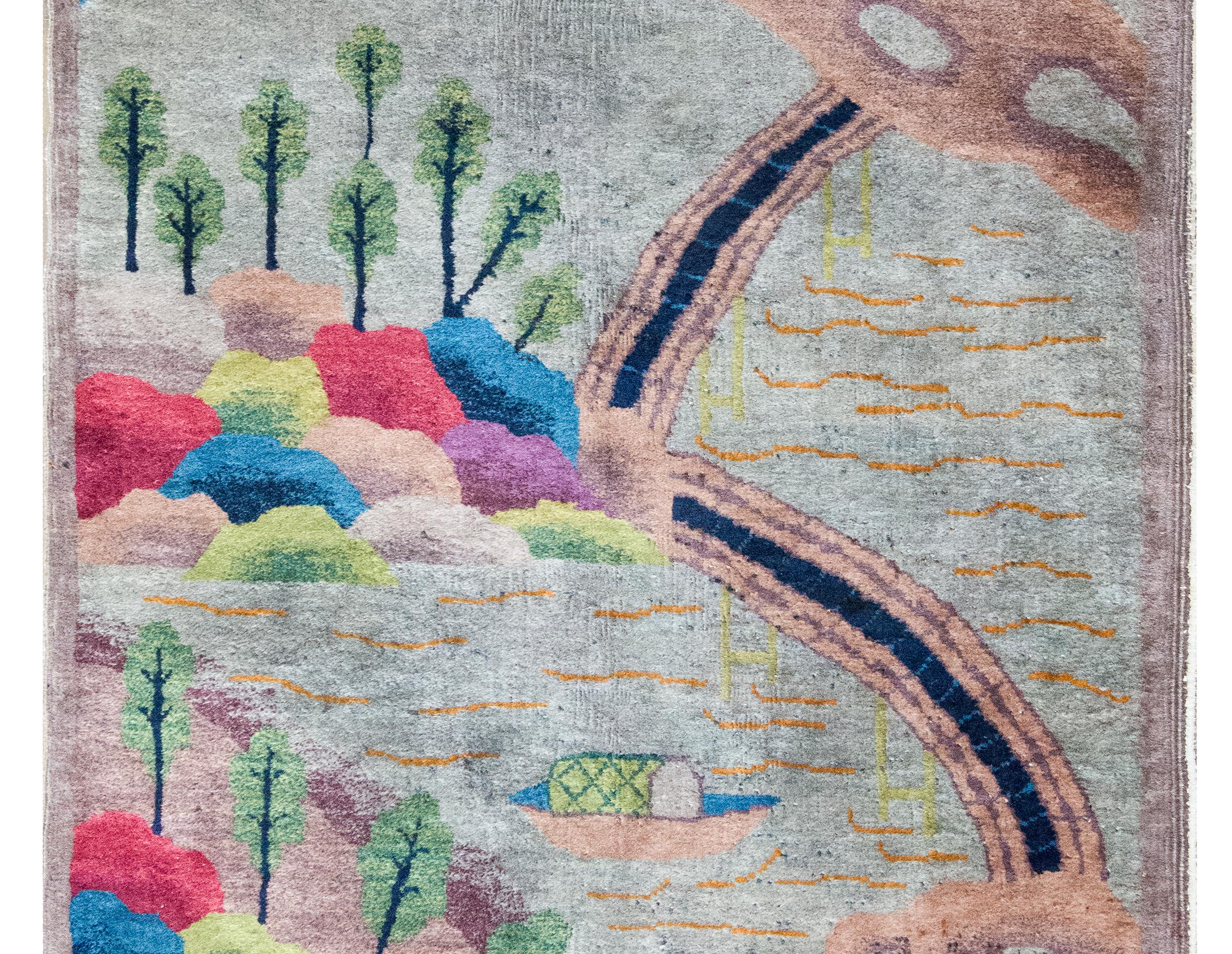 This early 20th-century Chinese Art Deco rug features a boldly imaginative garden landscape rendered in a vivid, unconventional palette of chartreuse green, cranberry, and shades of indigo. At its center, a tranquil pond scene is framed by whimsical