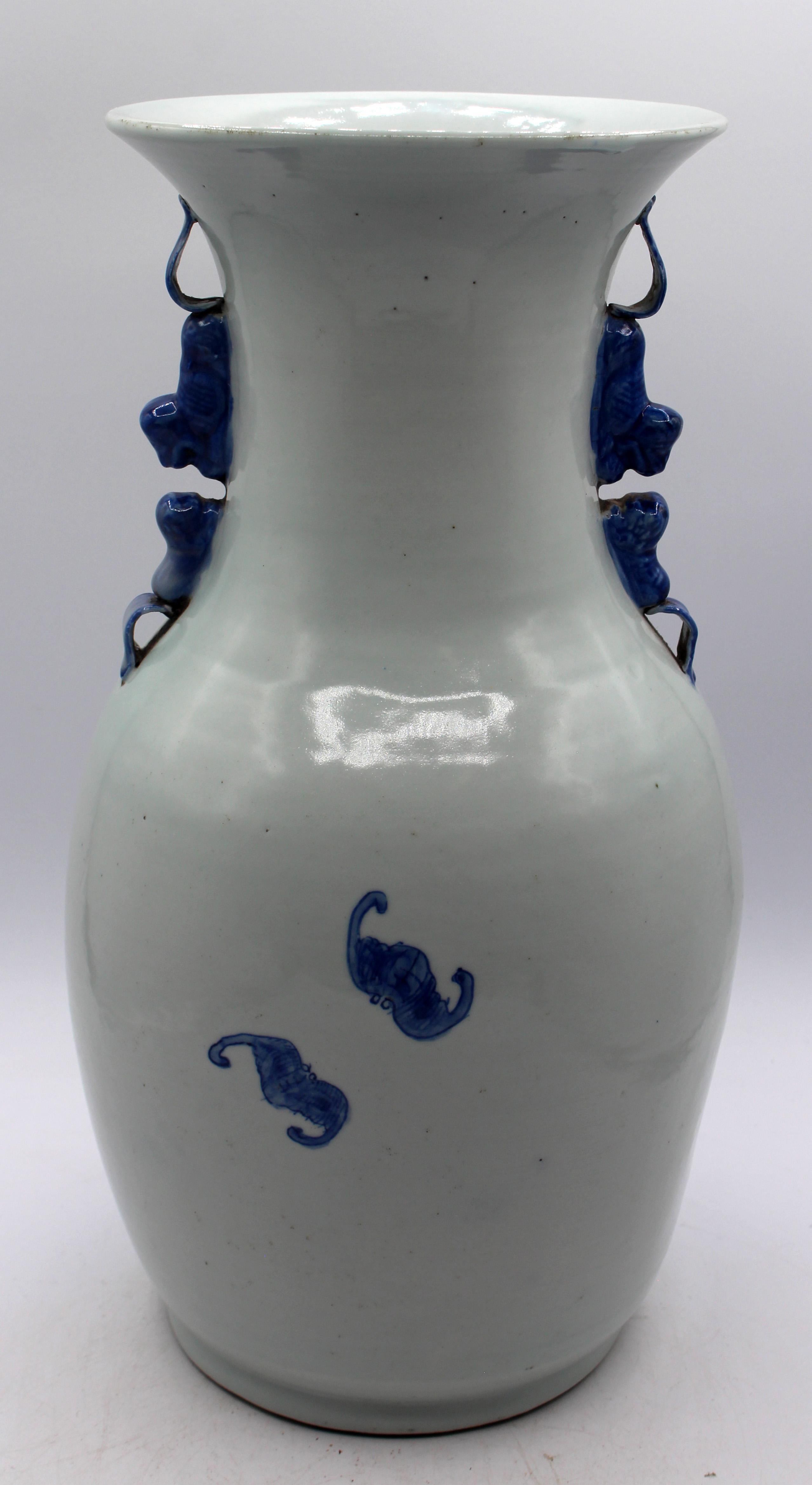 Early 20th century blue & white glazed porcelain vase, Chinese. Slight celadon hue. Late Qing to Republic Era. Featuring symbols of longevity & happiness - note the double gourd vase tied to a staff to carry water. Pairs of foo dogs for handles.