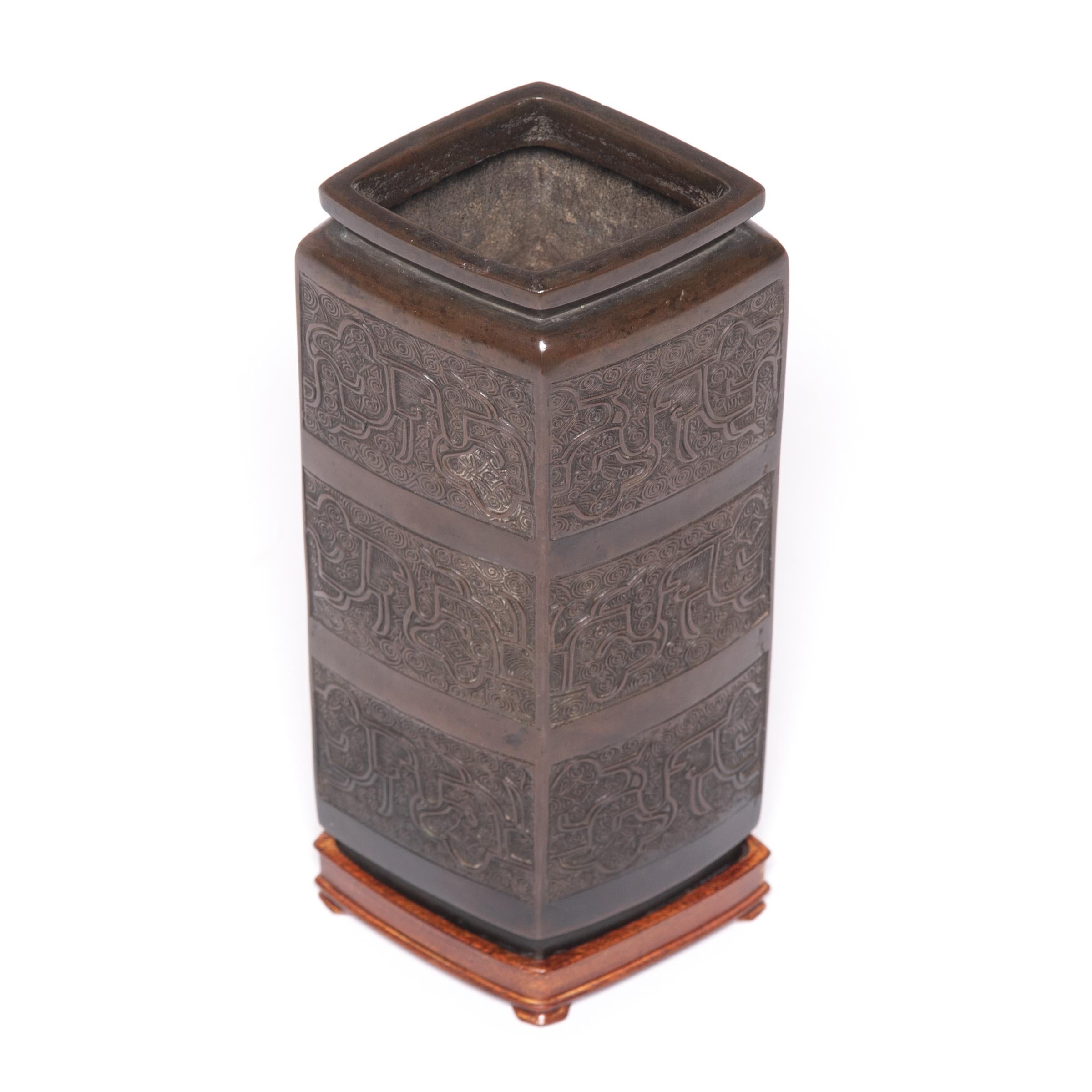 Chinese Bronze Relief Vase on Wooden Base, c. 1900 In Good Condition In Chicago, IL