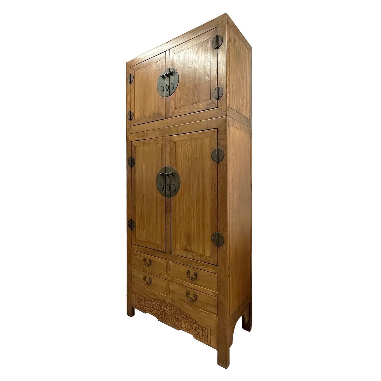 Of rectangular form, the well-figured, matched door panels fitted flush within the solidly constructed frame, simple flat door panels with natural wood grain on the front. This wedding wardrobe in two parts, with two sets of double doors, both with