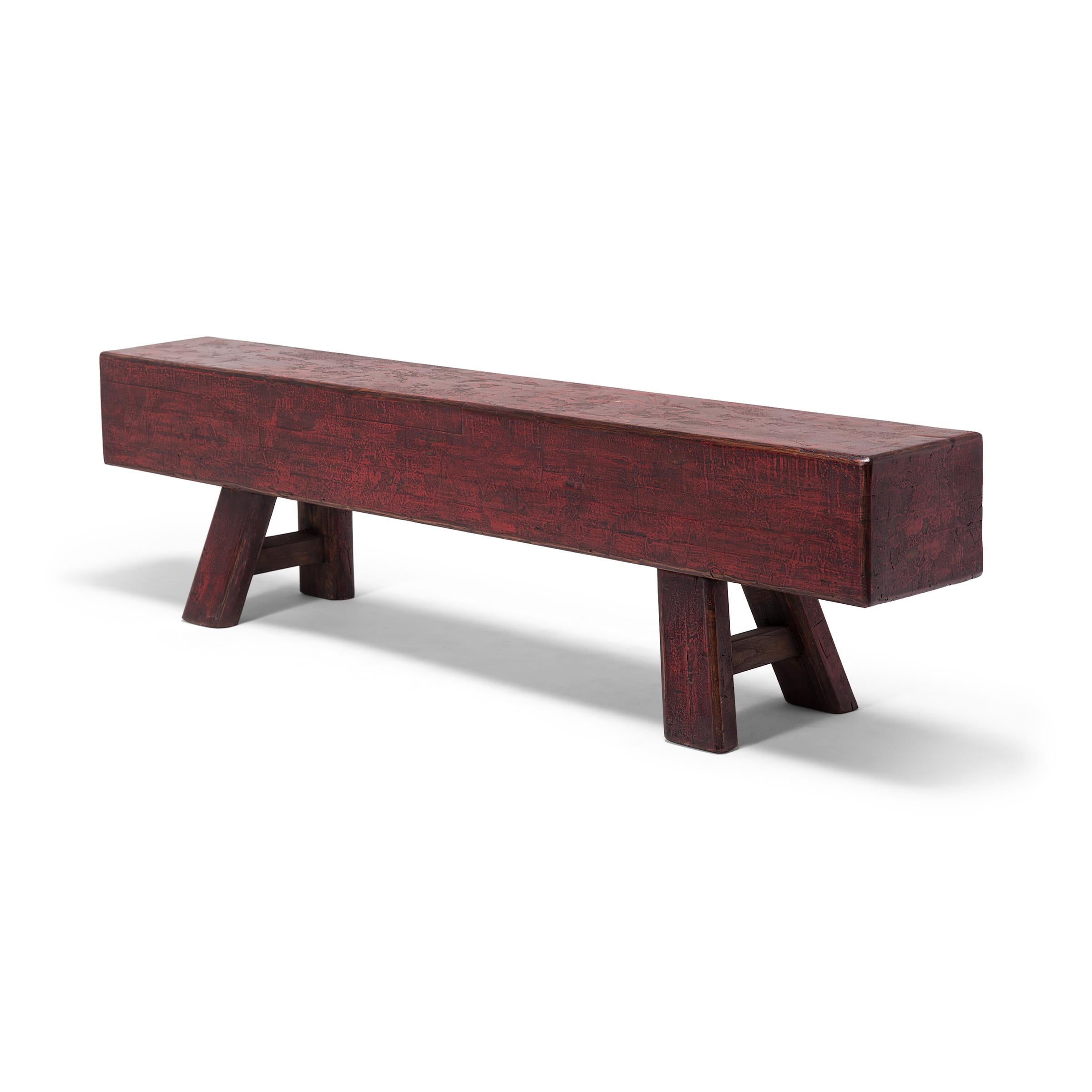 This grand red lacquer bench once provided versatile seating in the courtyard of a Qing-dynasty home. Not only was the sizable bench able to seat many guests during outdoor ceremonies, its imposing form could be used to barricade the home's tall