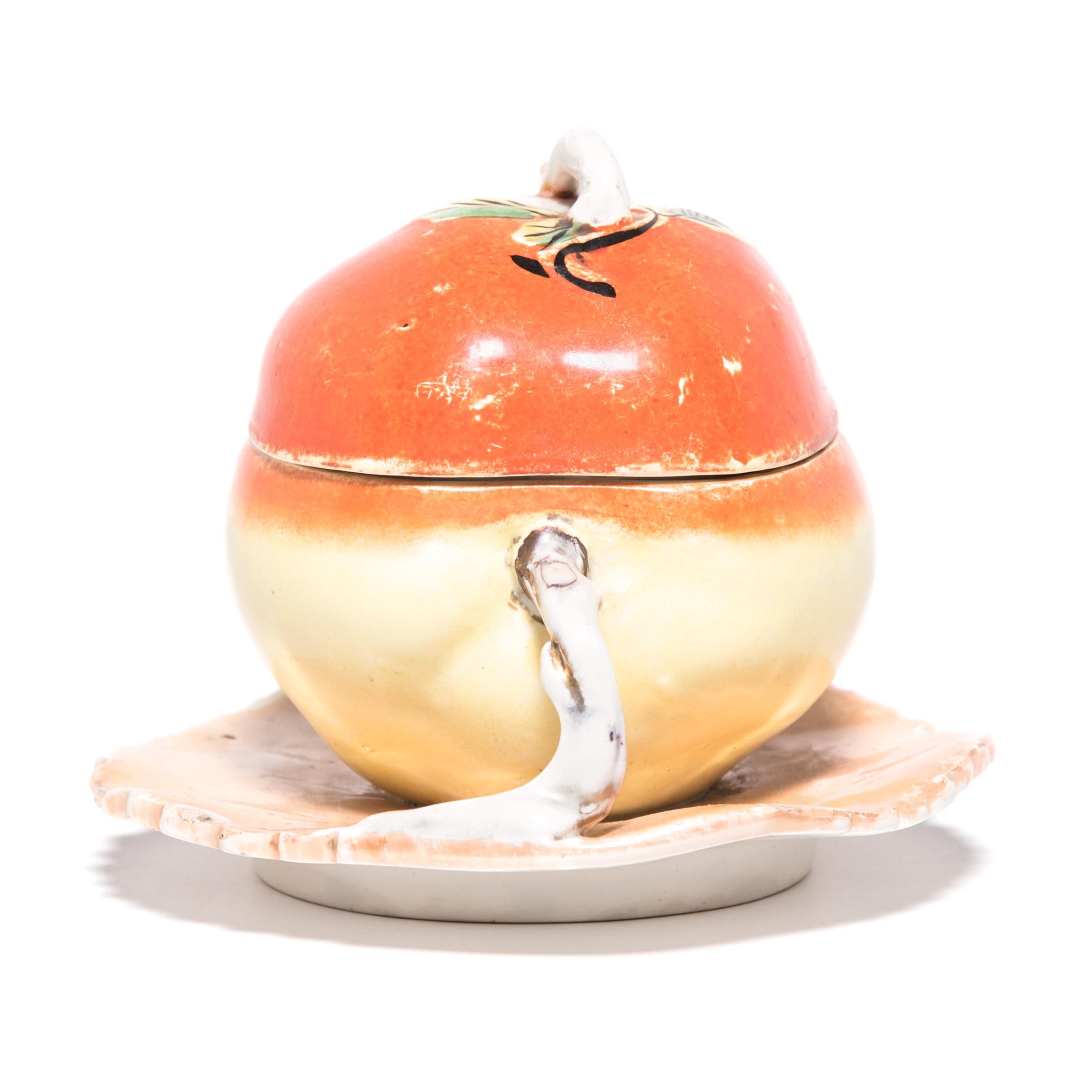This early 20th century covered porcelain peach container from northern China would have been a charming gift for a warm-weather birthday or wedding. Peaches represent spring, longevity, and marriage.