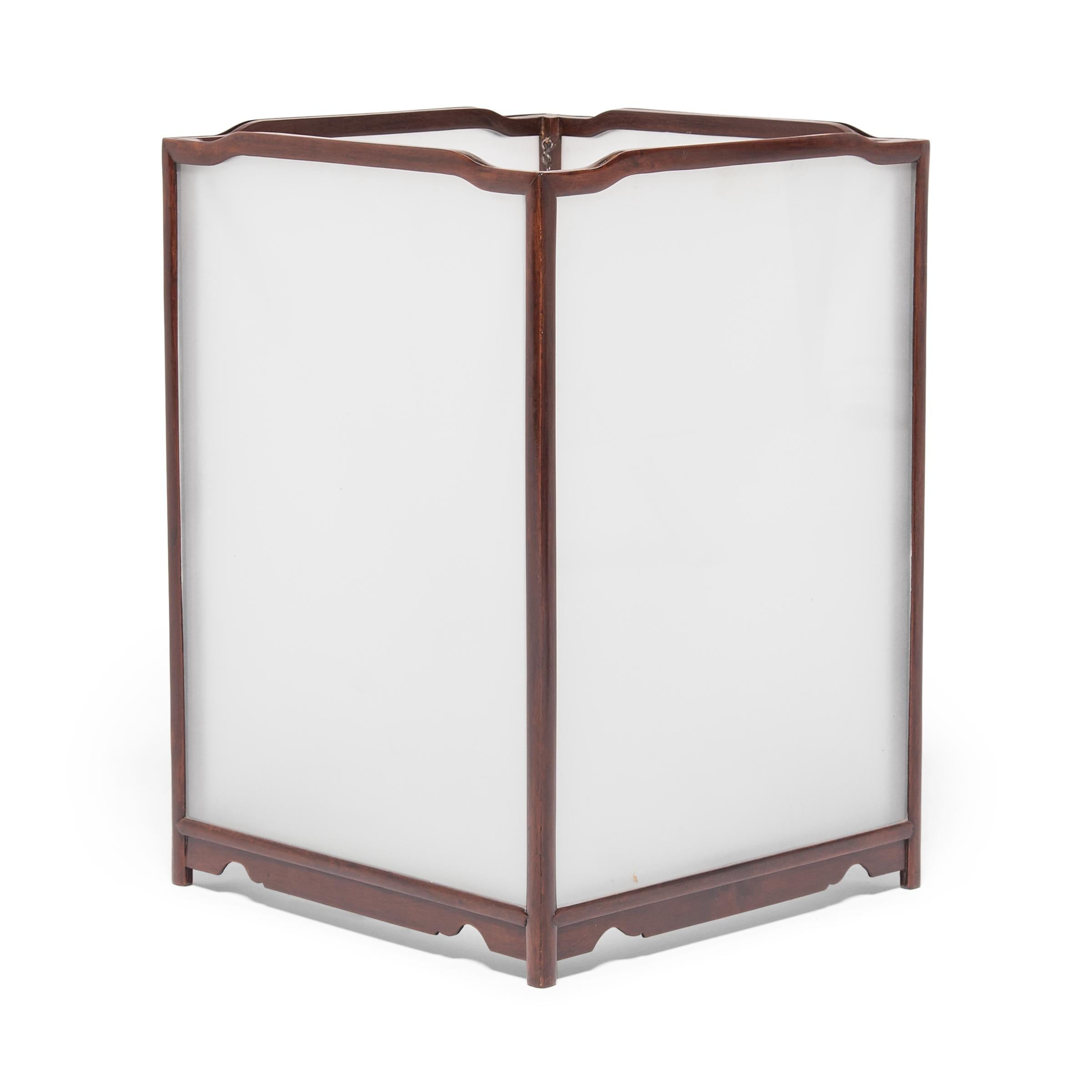 This elegant, delicately crafted lantern was made in northern China over a century ago. The simple frame is crafted of a fine hardwood and inset with panes of frosted glass. Lanterns in China have a history that goes back over 1,800 years to the Han