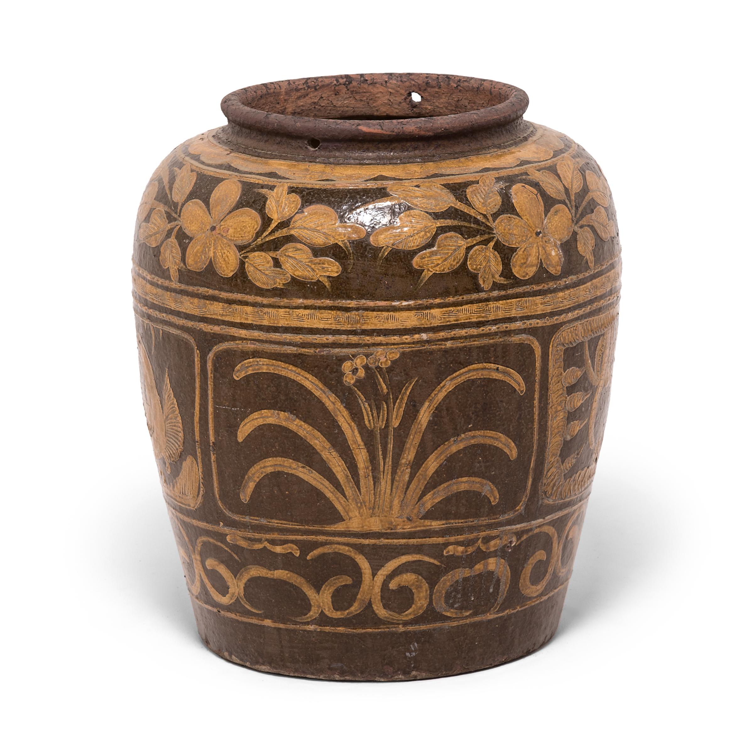 Unlike ceramics decorated with underglazing, this vase was painted after it was fired. This technique enabled the artist to build up areas and experiment with texture, visible in the stamped pattern along the painted bands and in the embossing of