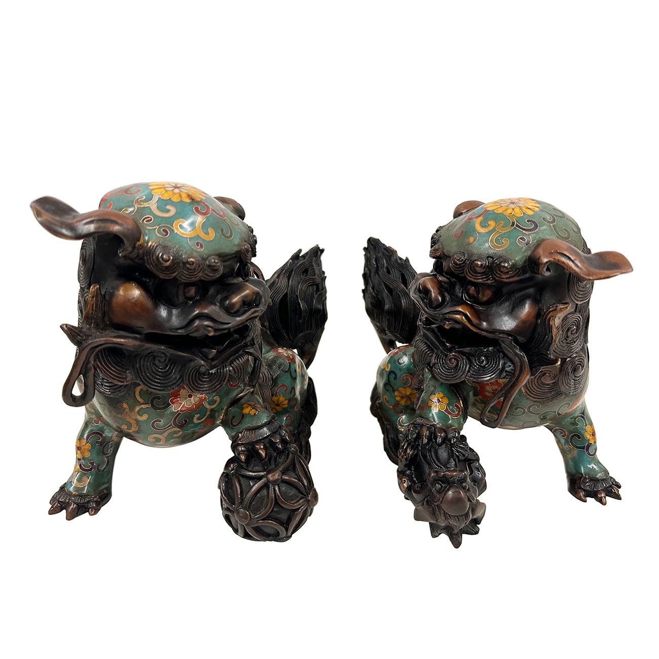 This pair of magnificent Chinese Cloisonné Foo Dog are the perfect decor pieces. With beautiful floral design, it is a majestically hand crafted work of art that is sure to capture everyone’s attention. Very beautiful. A lot of detailed art works on