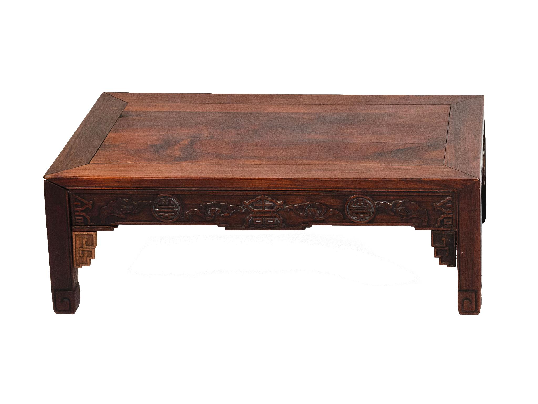 An early 20th century Chinese hongmu low table with fine woodwork craftsmanship The table is comprised of richly toned redwood. Carved detailing adorns the skirt and legs.

Dimensions:
39 in. width
19.5 in. depth
11 in. height.