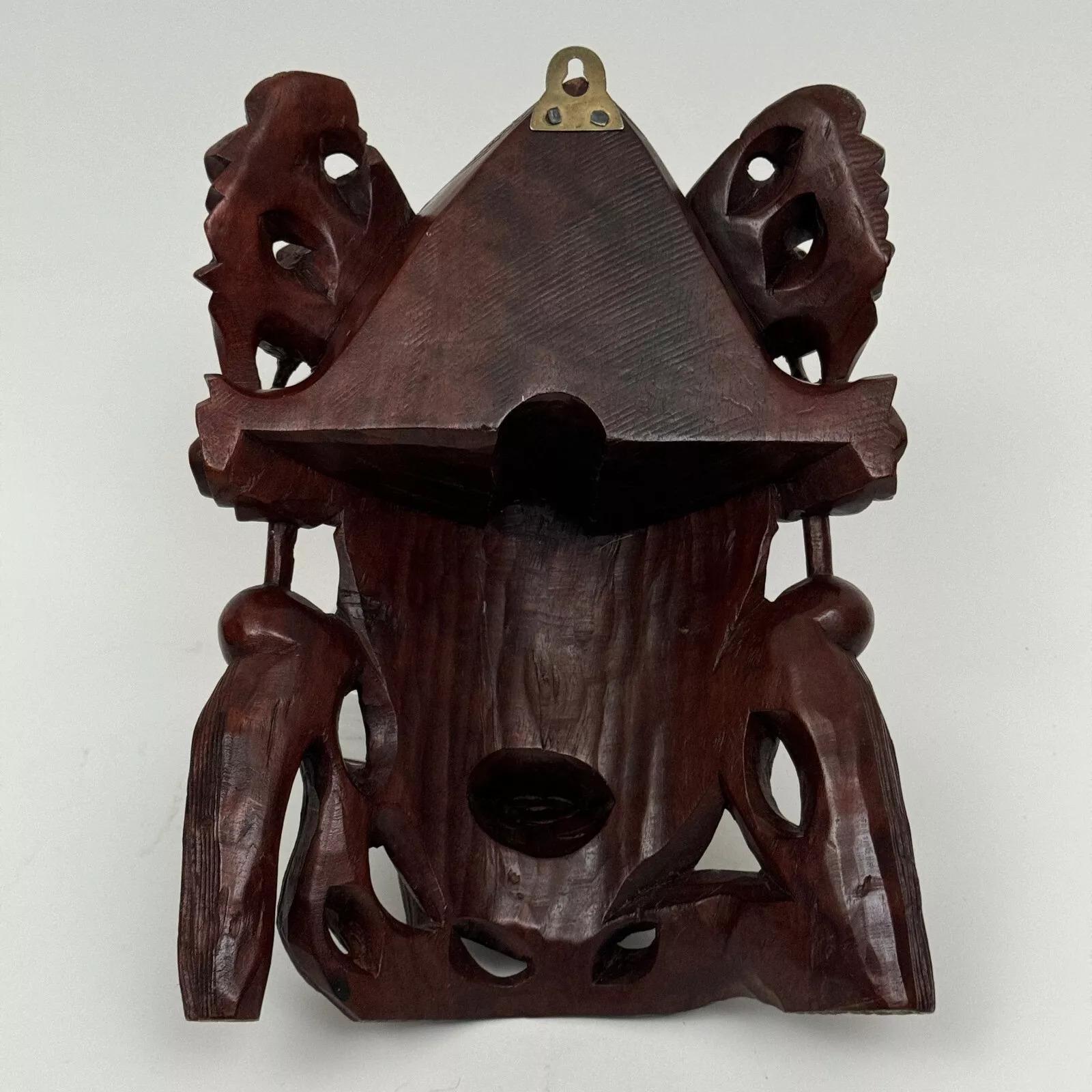 Ironwood mask China early 20th century representing a wise man with rich ornamentation 

The eyes of this ironwood mask are probably made of sulphide, the patina is pretty.
As for the condition, note traces of wear due to use, small dents, a crack