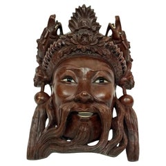 Masque chinois en bois de fer du début du 20e siècle représentant un sage
