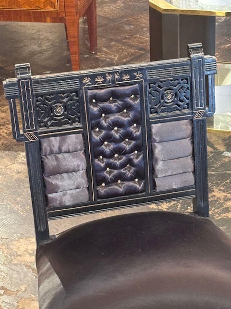 Very fine early 20th century Chinese lacquered chair. Featuring beautiful carvings and gilt accents with rolled and tufted upholstery. Lovely and very unique! Circa 1920.
19w x 18d x 33h