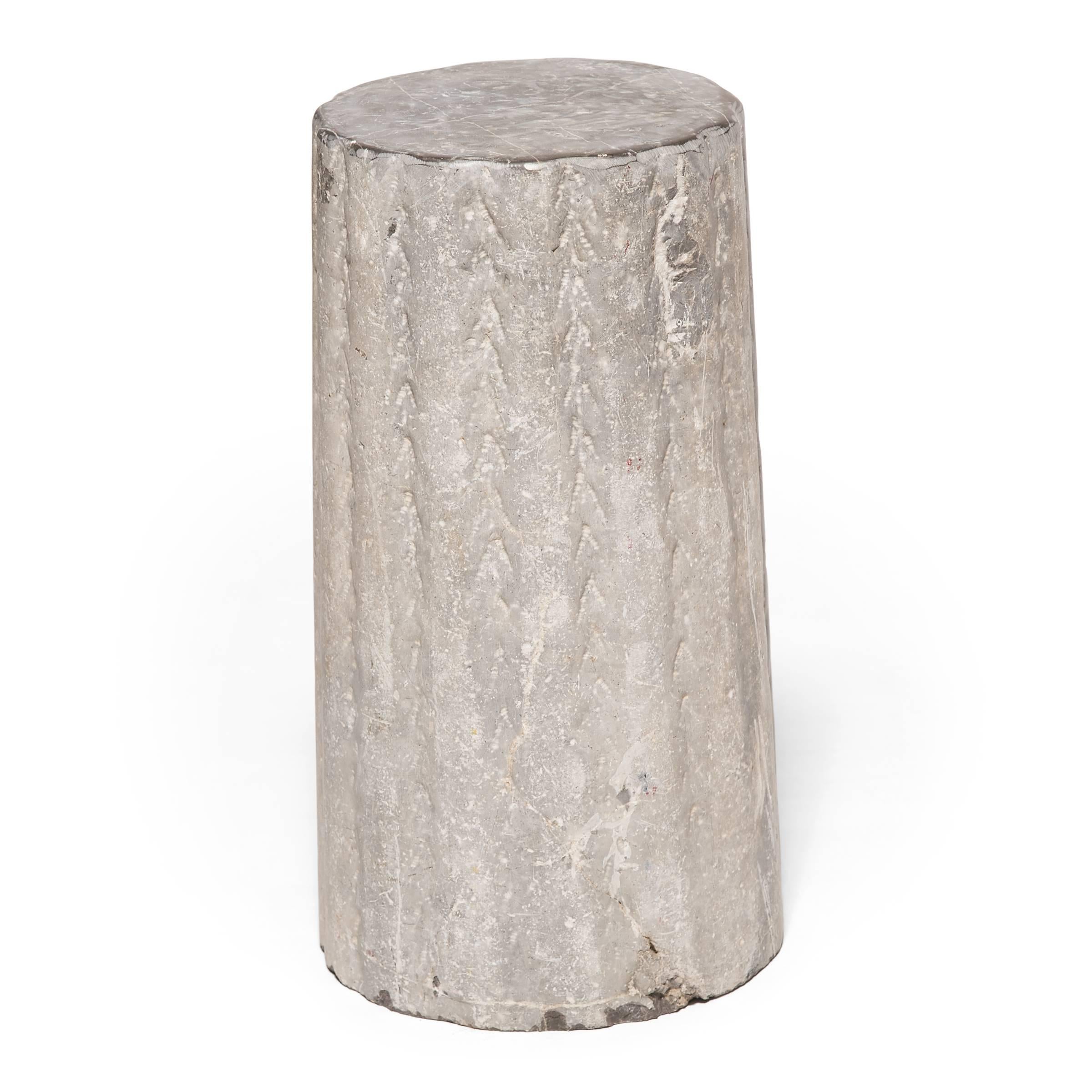 With a textured and ribbed surface, this hand-carved stone once ground grain and nuts at a Hebei province wind or watermill. Over a hundred years old, the stone’s surface has worn down through use, leaving only a hint of its original texture. A