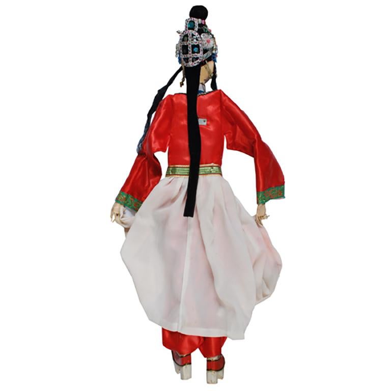 Dressed in fine silks trimmed with embroidered bands and tassels, this puppet brought the glory of the imperial court to the small stage as part of an early 20th century puppet opera. Complete with songs, acrobatics, farce, and drama, Chinese Puppet