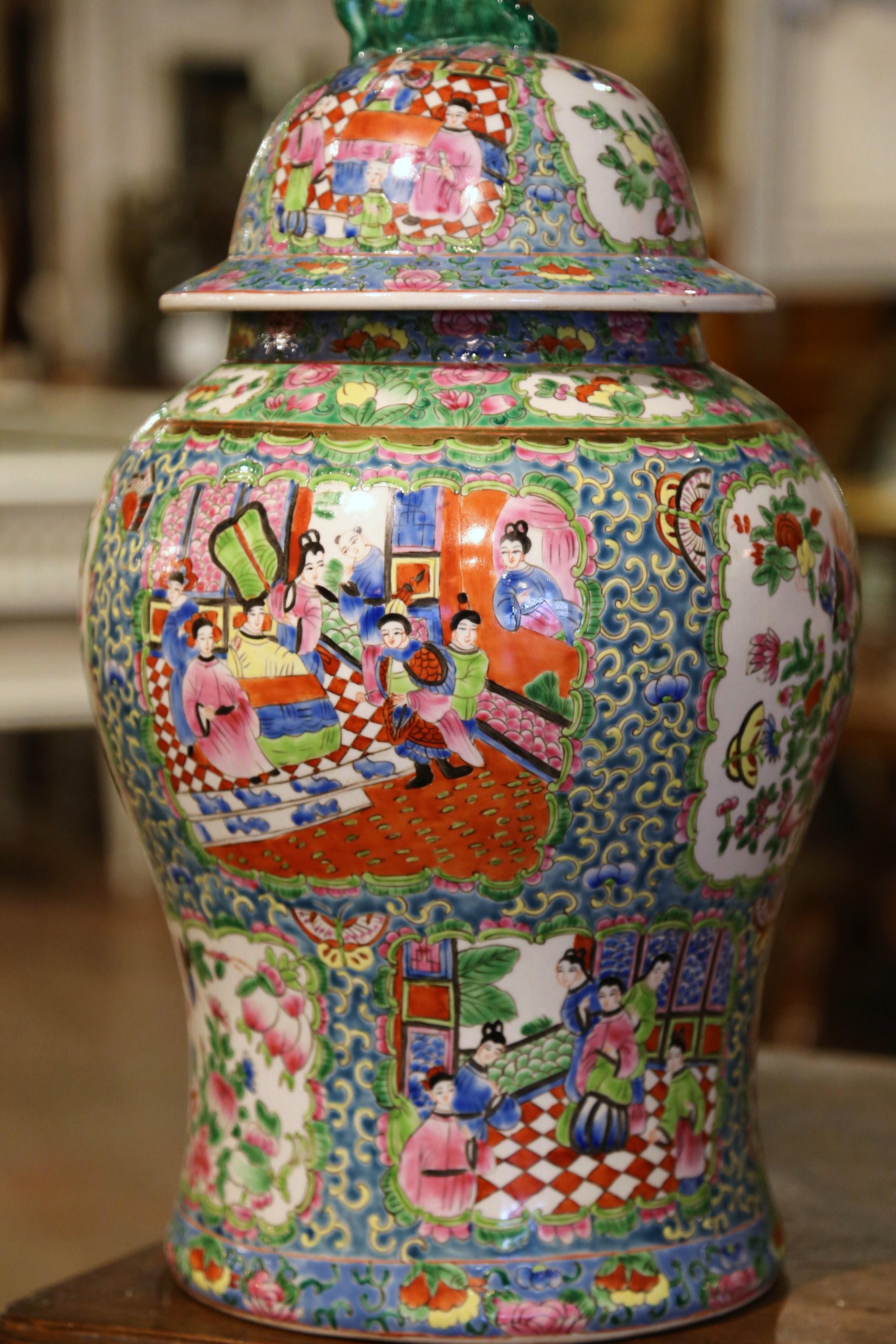 Decorate a console or mantle with this important antique porcelain ginger jar. Created in China, circa 1920 and attributed to Canton Famille Rose, the colorful vase is decorated with hand painted floral medallions and oriental scenes, and further