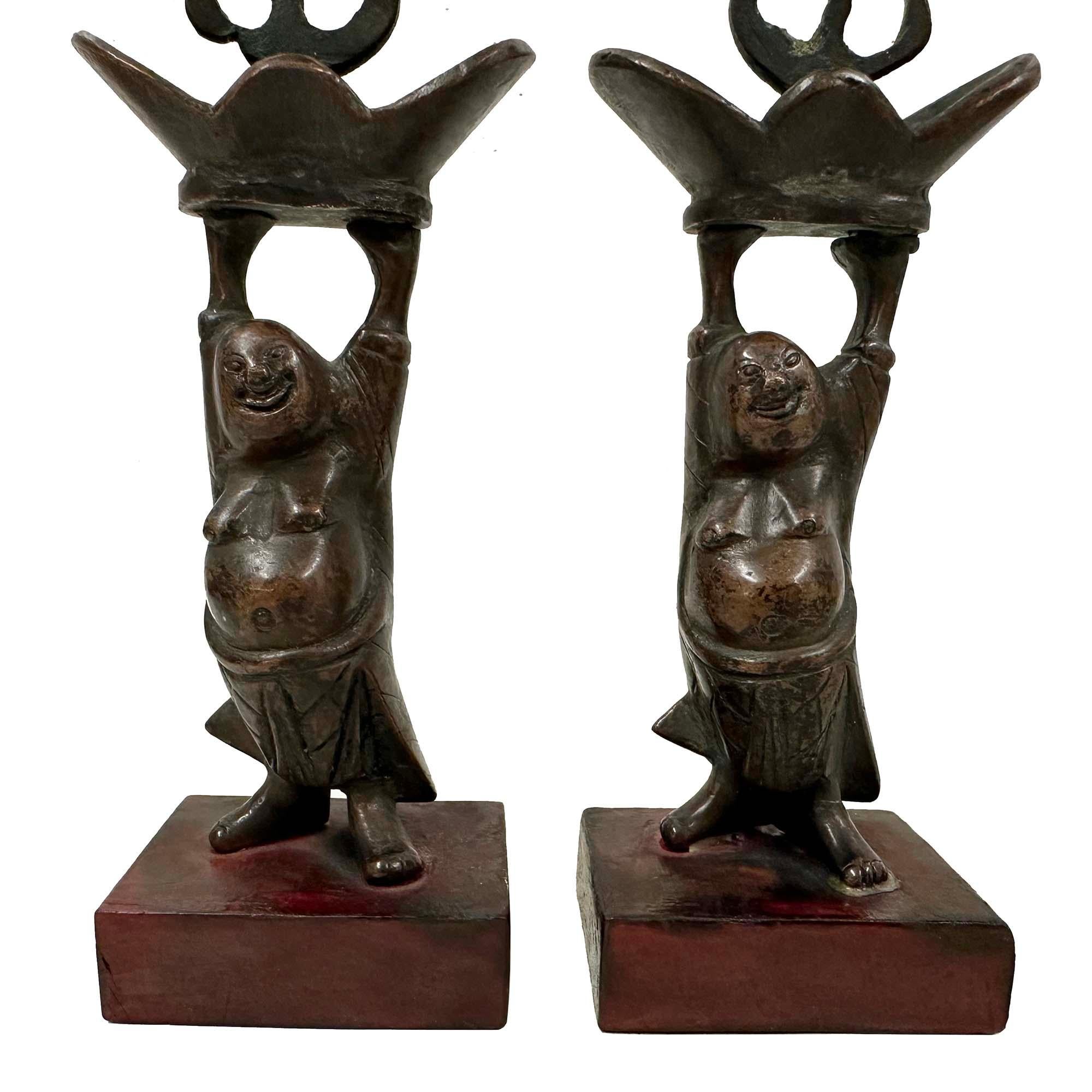 Esportazione cinese Early 20th Century Chinese Pair of Bronze Happy Buddha Candle Holders in vendita